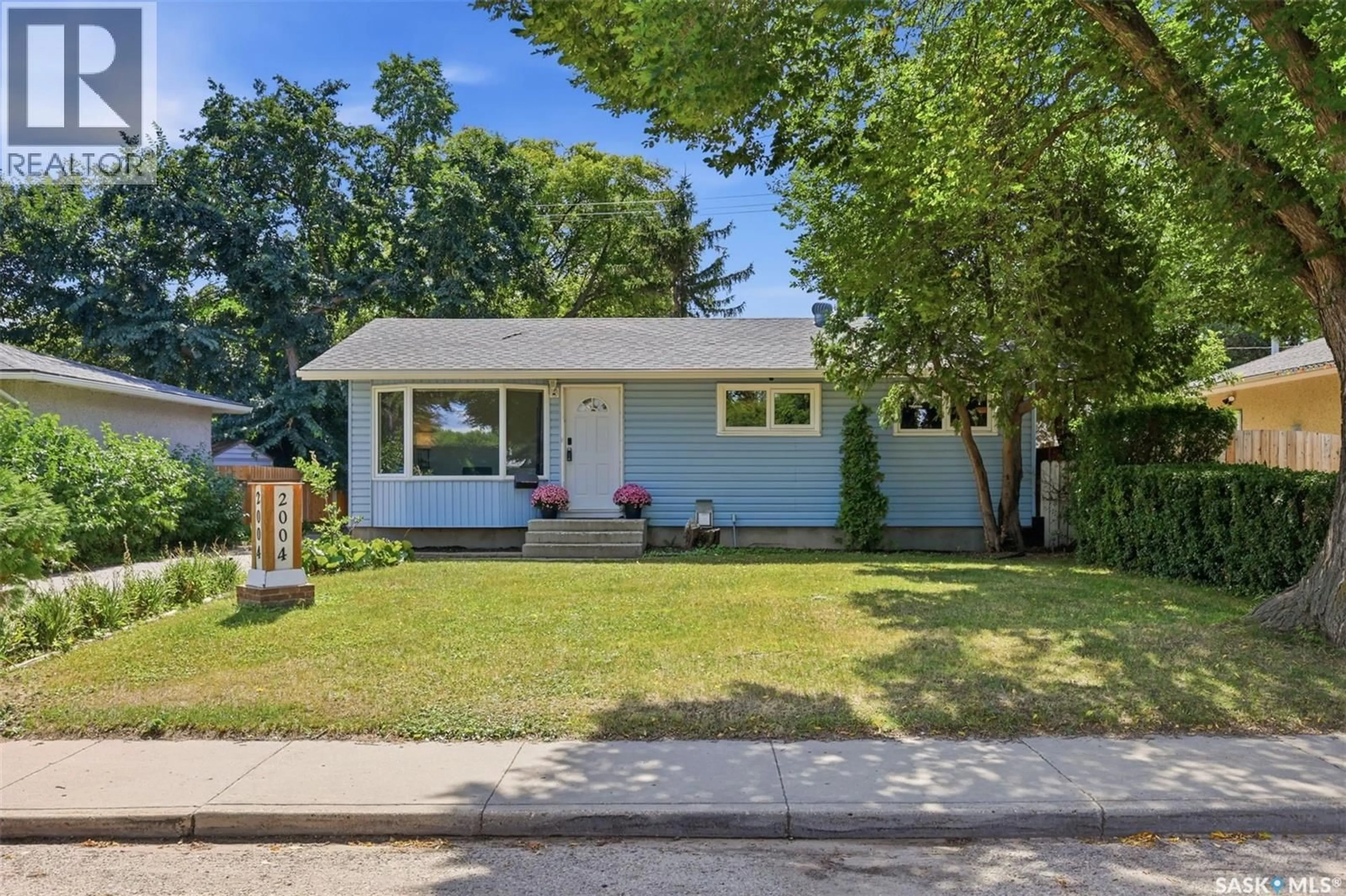 Home with vinyl exterior material, street for 2004 ADELAIDE STREET, Saskatoon Saskatchewan S7J3K3