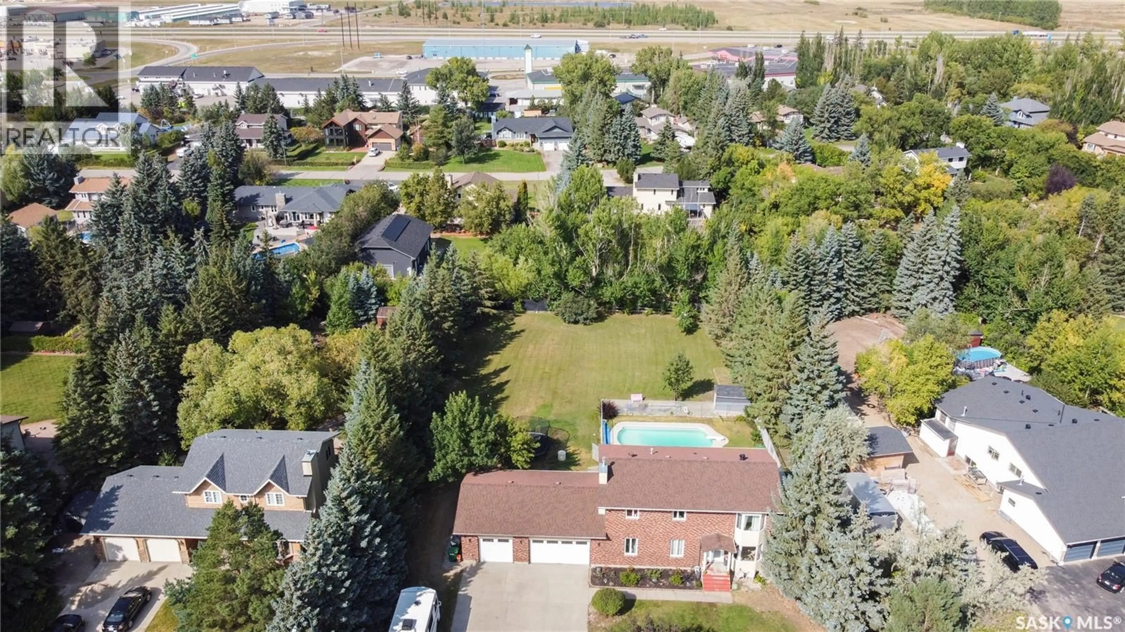 A pic from outside/outdoor area/front of a property/back of a property/a pic from drone, mountain view for 18 PEARL CRESCENT, Edenwold Rm No.158 Saskatchewan S4L1A5