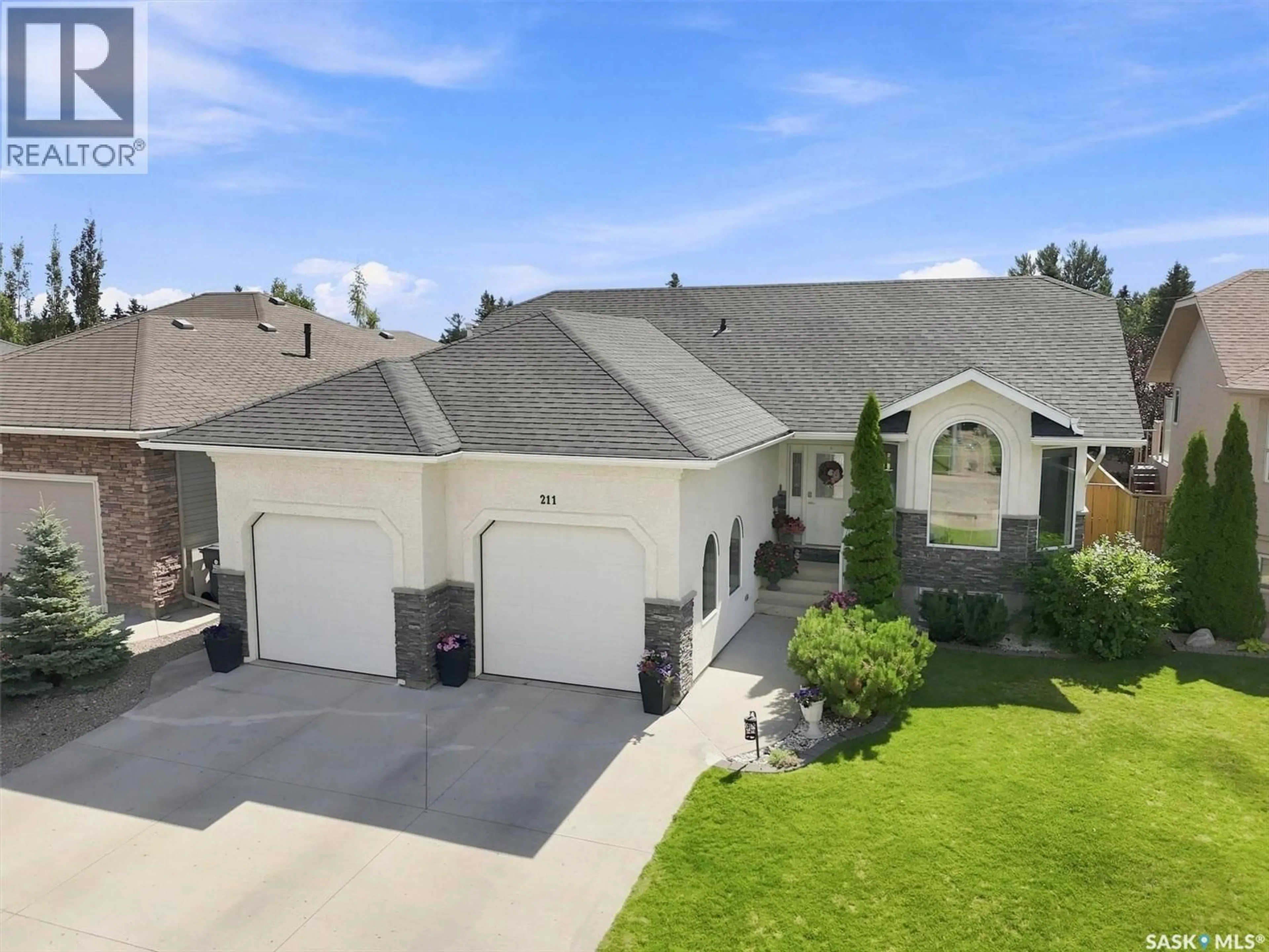 A pic from outside/outdoor area/front of a property/back of a property/a pic from drone, street for 211 CRENSHAW WAY, Warman Saskatchewan S0K4S1