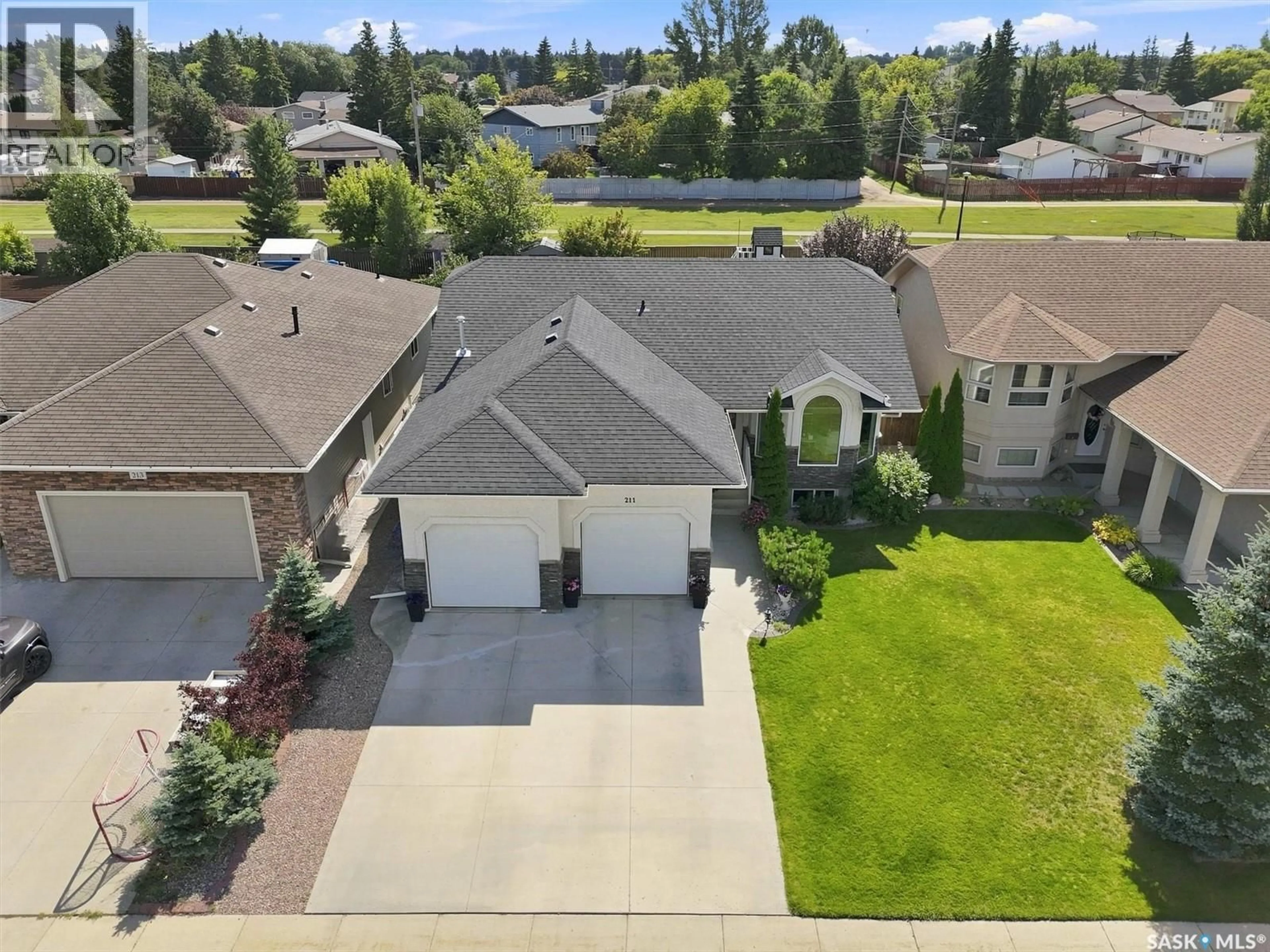 A pic from outside/outdoor area/front of a property/back of a property/a pic from drone, street for 211 CRENSHAW WAY, Warman Saskatchewan S0K4S1