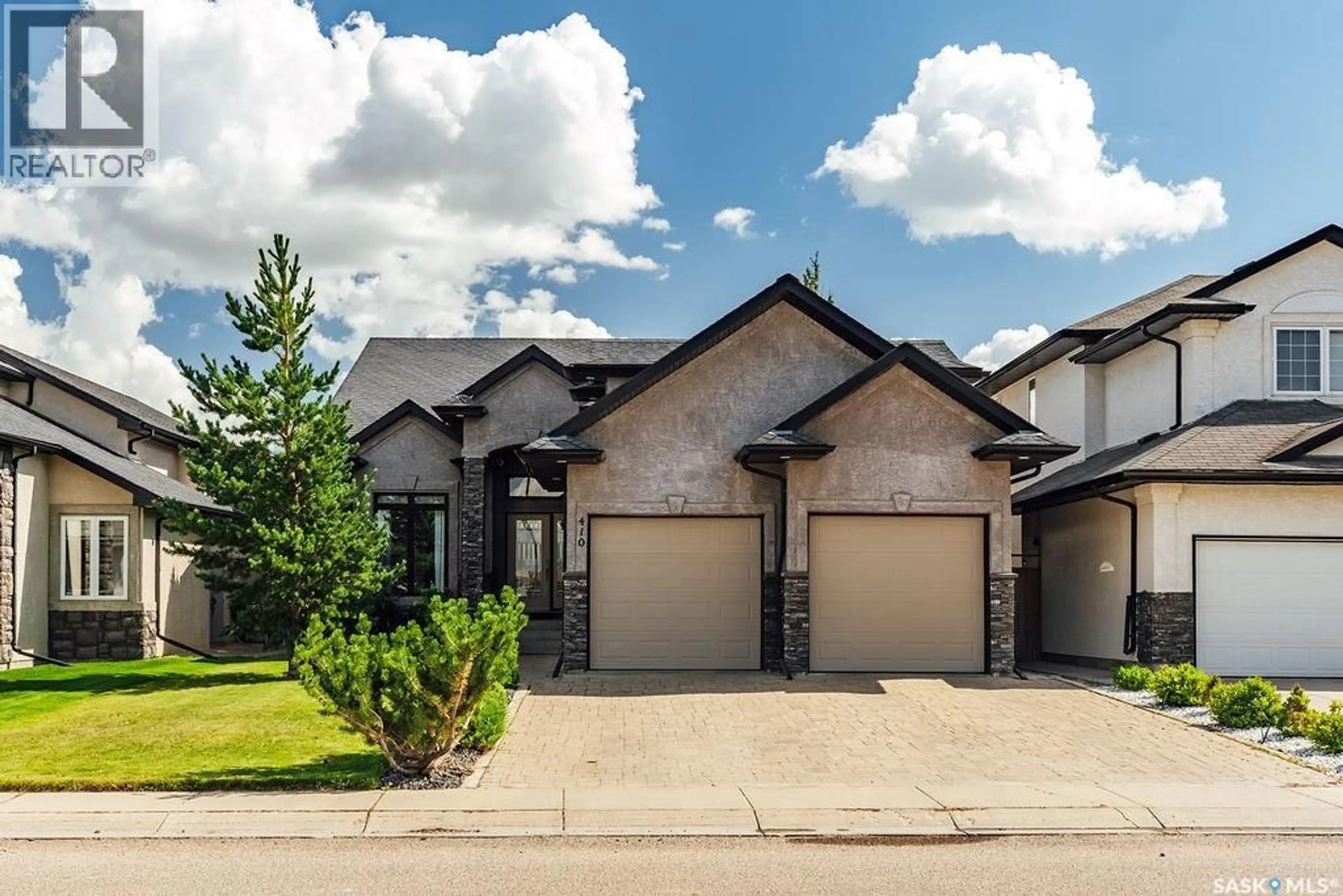 Home with brick exterior material, street for 410 WILLOWGROVE CRESCENT, Saskatoon Saskatchewan S7W0A7