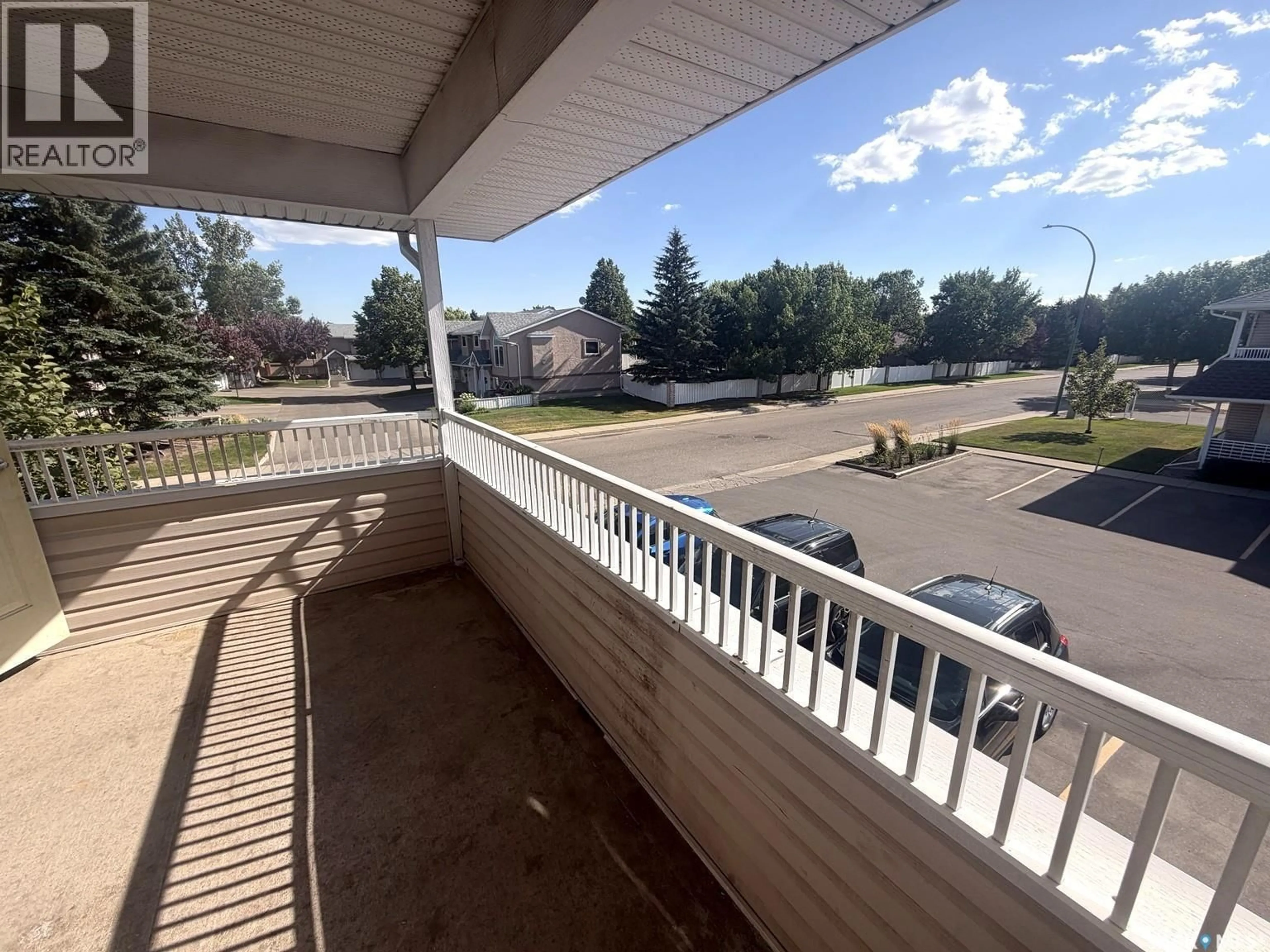 Patio, city buildings view from balcony for 3287 WOODHAMS DRIVE, Regina Saskatchewan S4V3A2