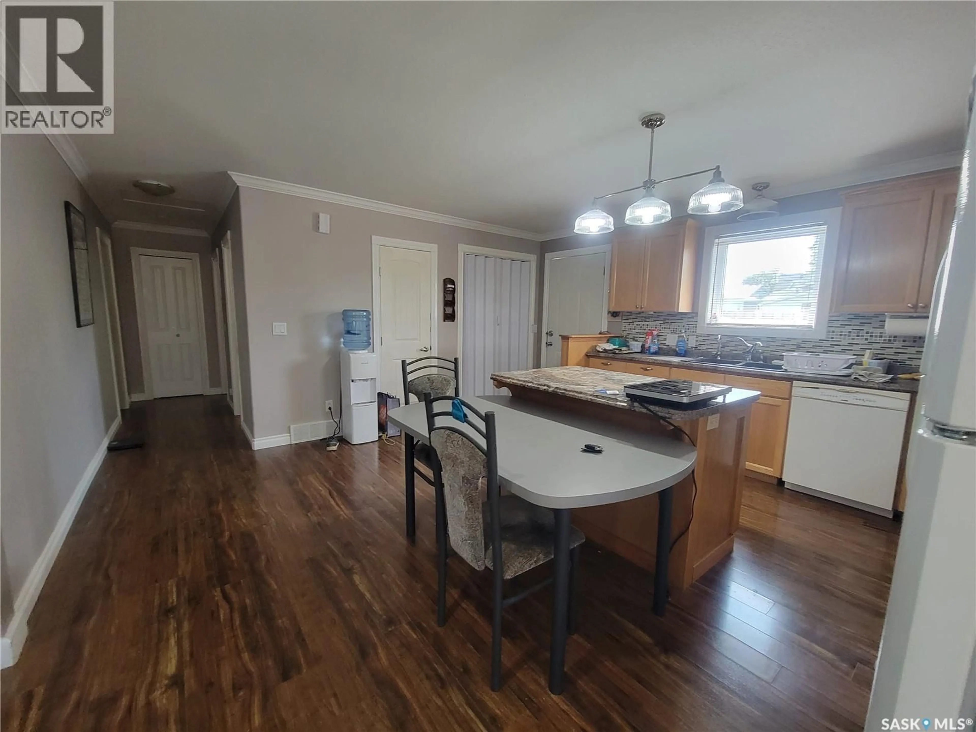 Open concept kitchen, wood/laminate floor for 118 2ND STREET, St. Walburg Saskatchewan S0M2T0