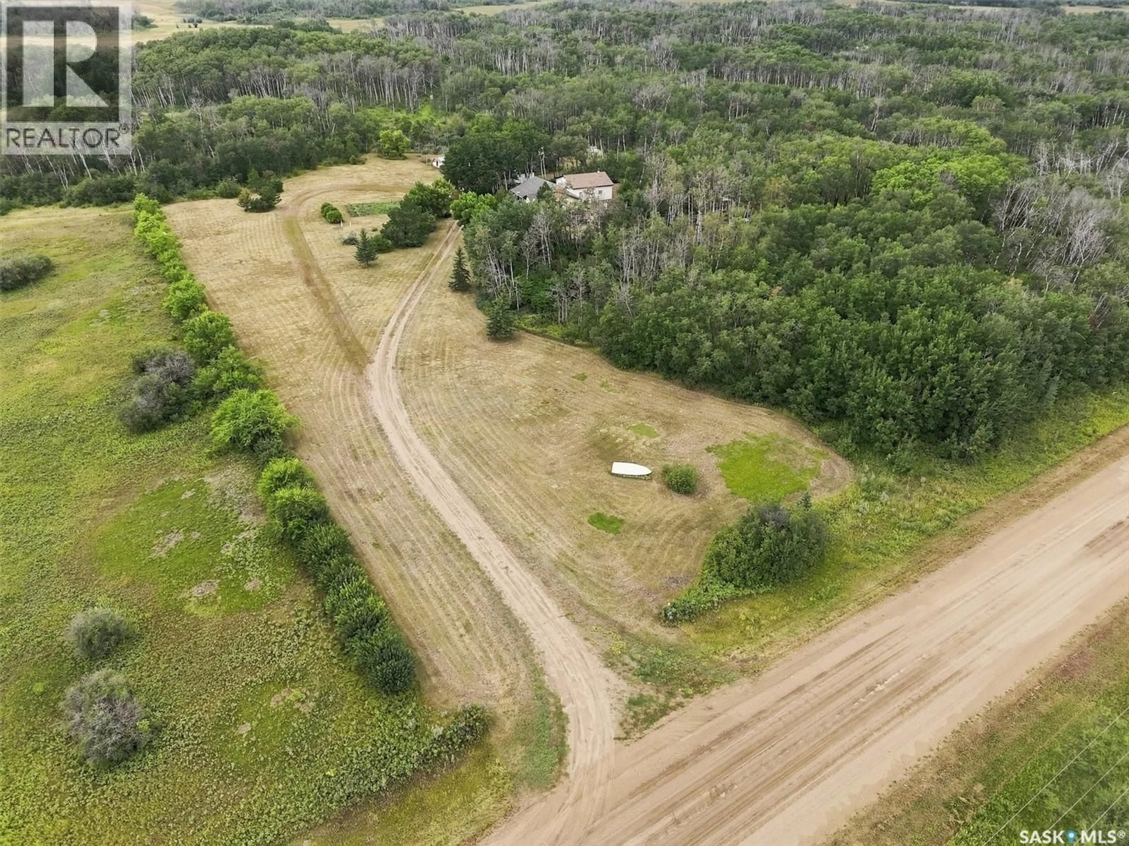 A pic from outside/outdoor area/front of a property/back of a property/a pic from drone, forest/trees view for NYSTUEN LEE ACREAGE, Asquith Saskatchewan S0K1V0