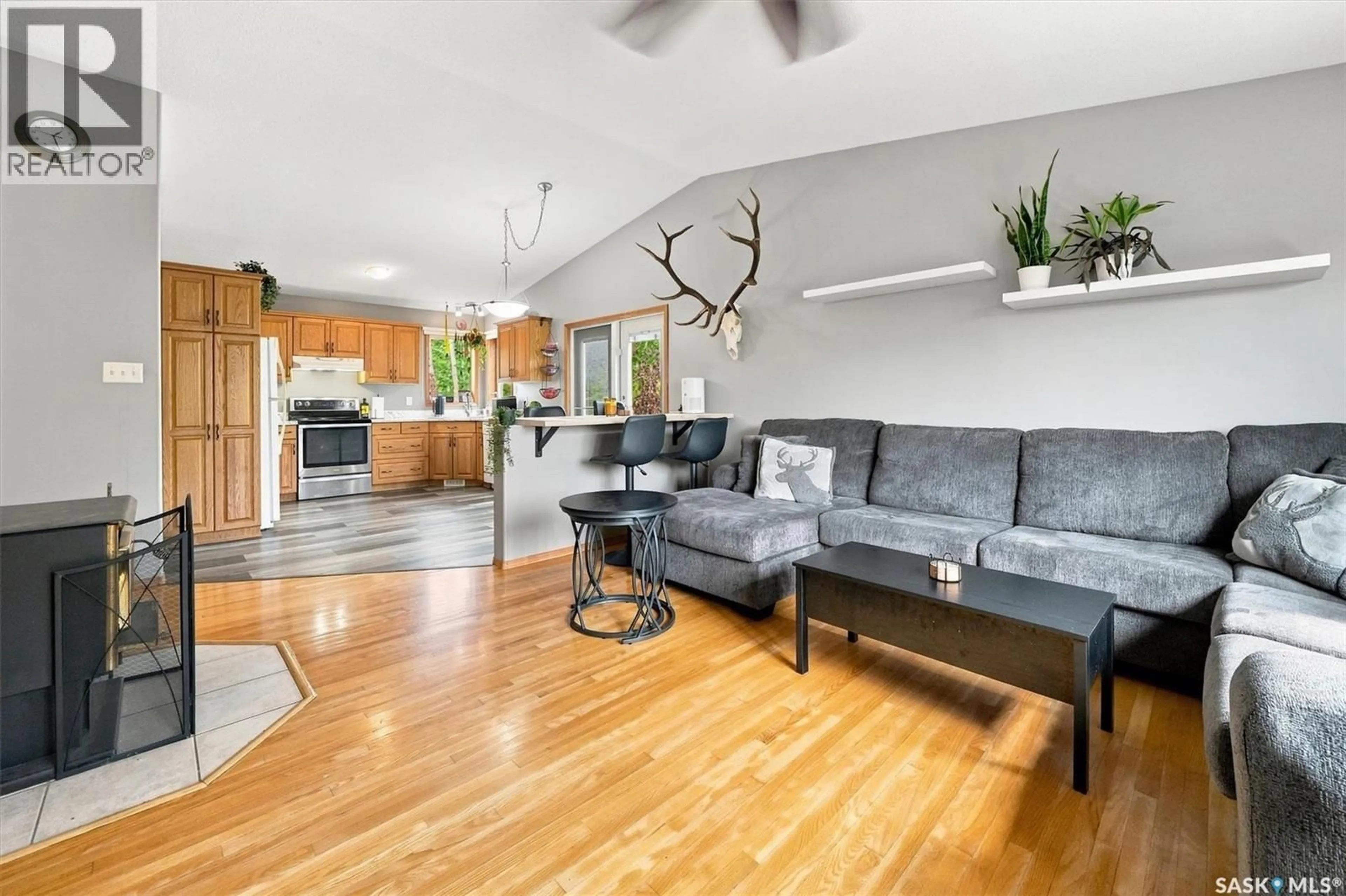 Living room with furniture, wood/laminate floor for NYSTUEN LEE ACREAGE, Asquith Saskatchewan S0K1V0