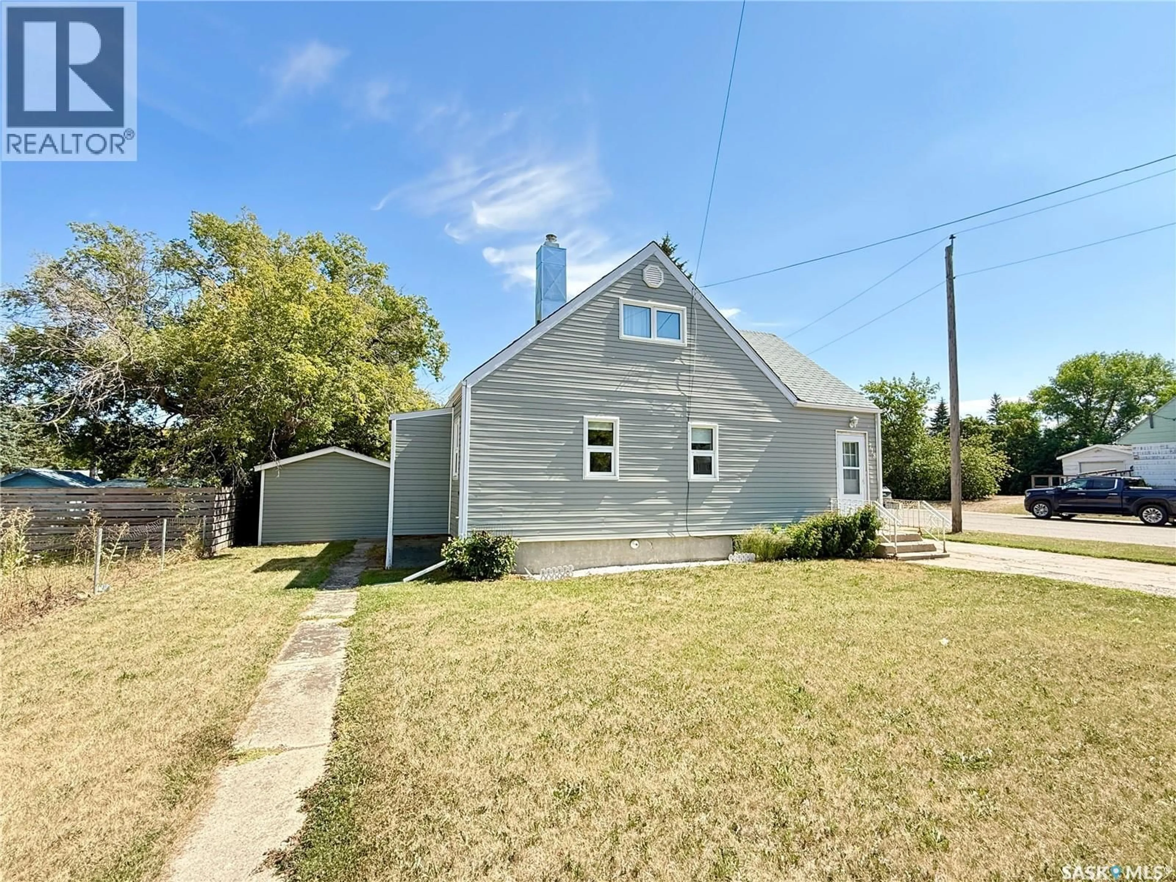 Home with vinyl exterior material, street for 718 4TH STREET, Weyburn Saskatchewan S4H2G3