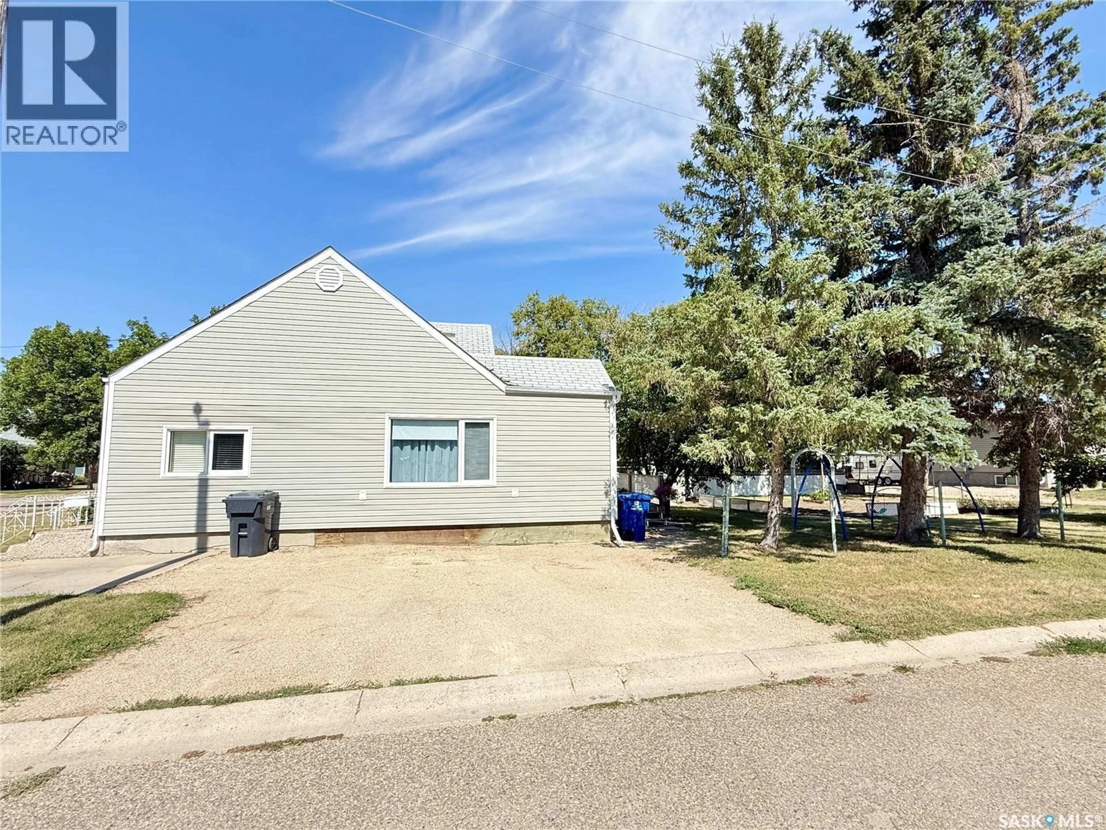 A pic from outside/outdoor area/front of a property/back of a property/a pic from drone, street for 718 4TH STREET, Weyburn Saskatchewan S4H2G3