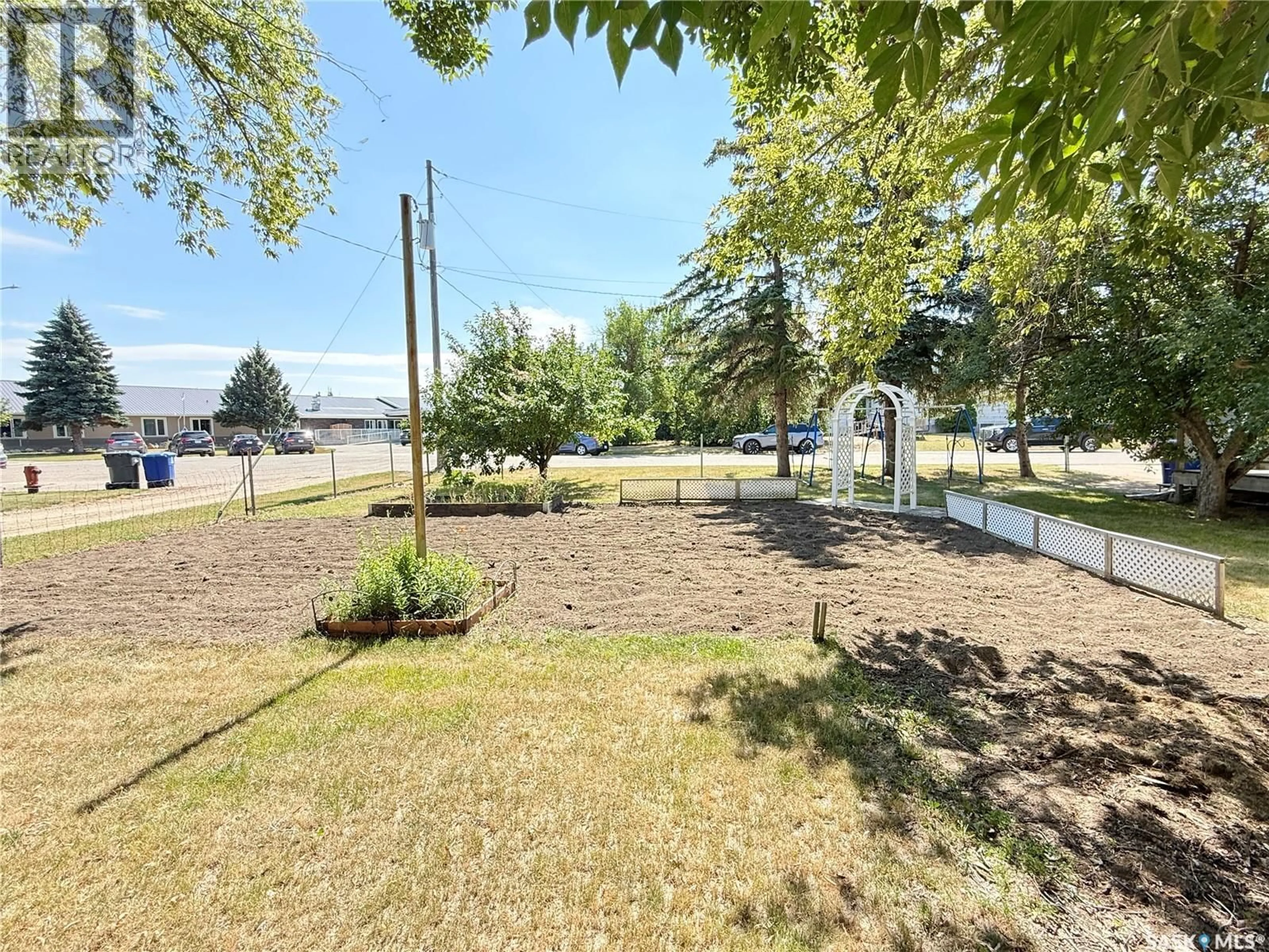 A pic from outside/outdoor area/front of a property/back of a property/a pic from drone, water/lake/river/ocean view for 718 4TH STREET, Weyburn Saskatchewan S4H2G3