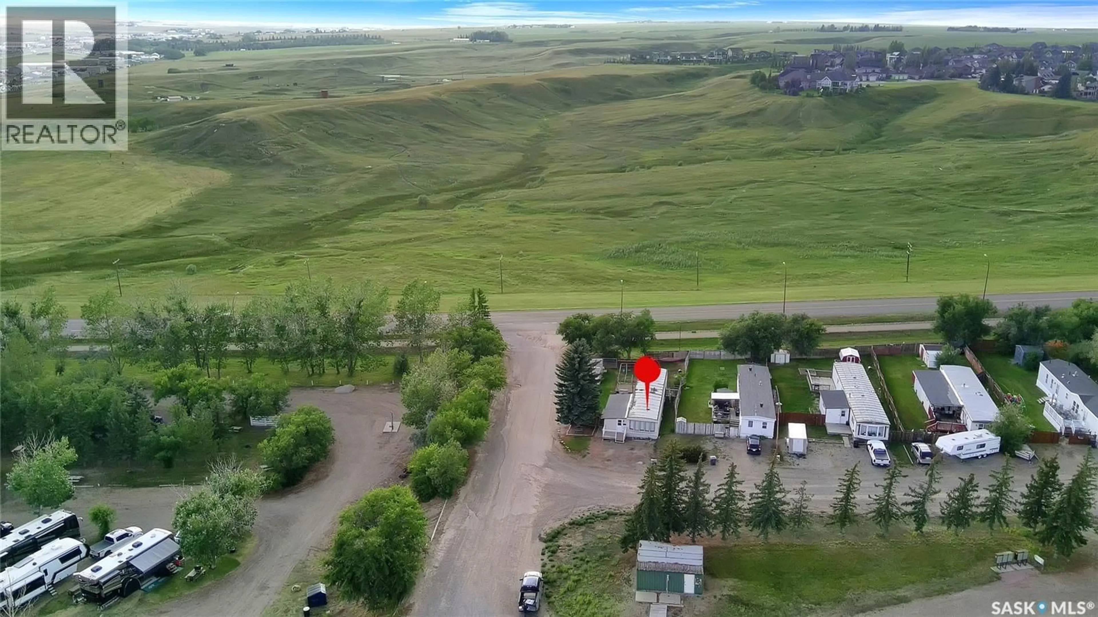 A pic from outside/outdoor area/front of a property/back of a property/a pic from drone, unknown for 1701 11TH AVENUE, Swift Current Saskatchewan S9H4M5