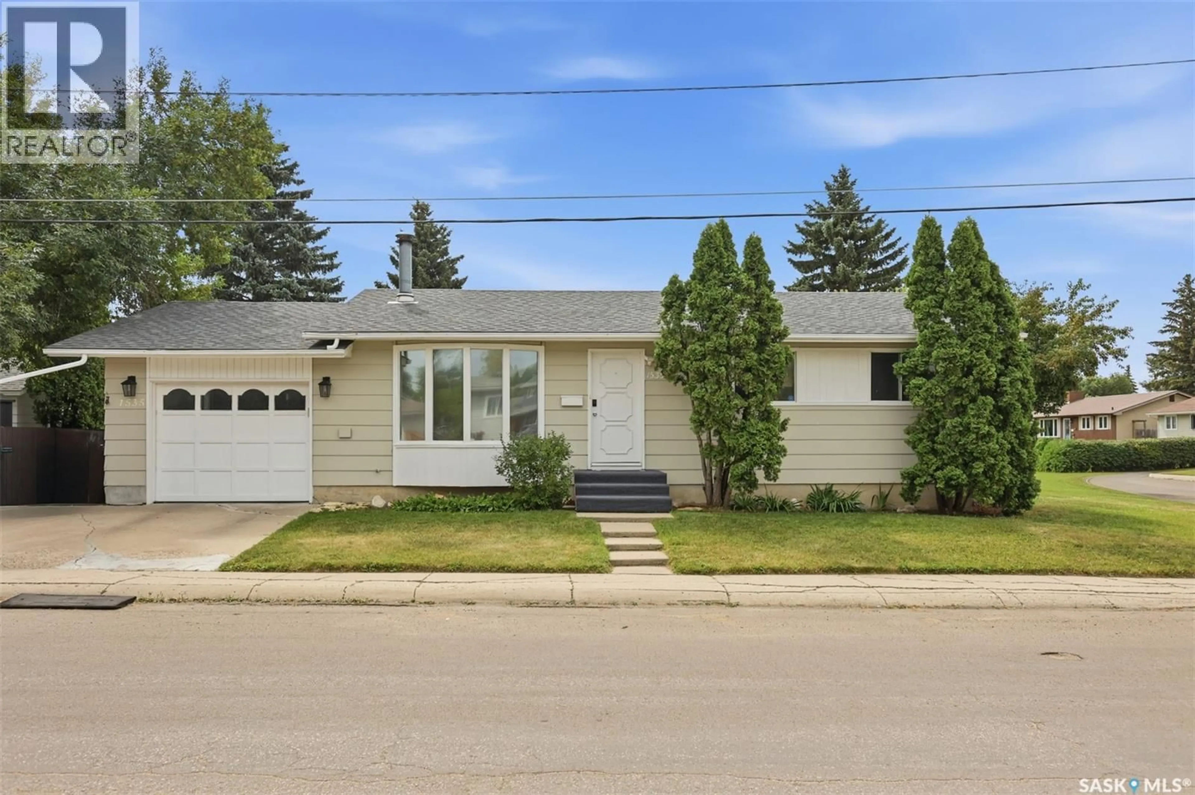 Home with vinyl exterior material, street for 1535 LAURA AVENUE, Saskatoon Saskatchewan S7N2R8