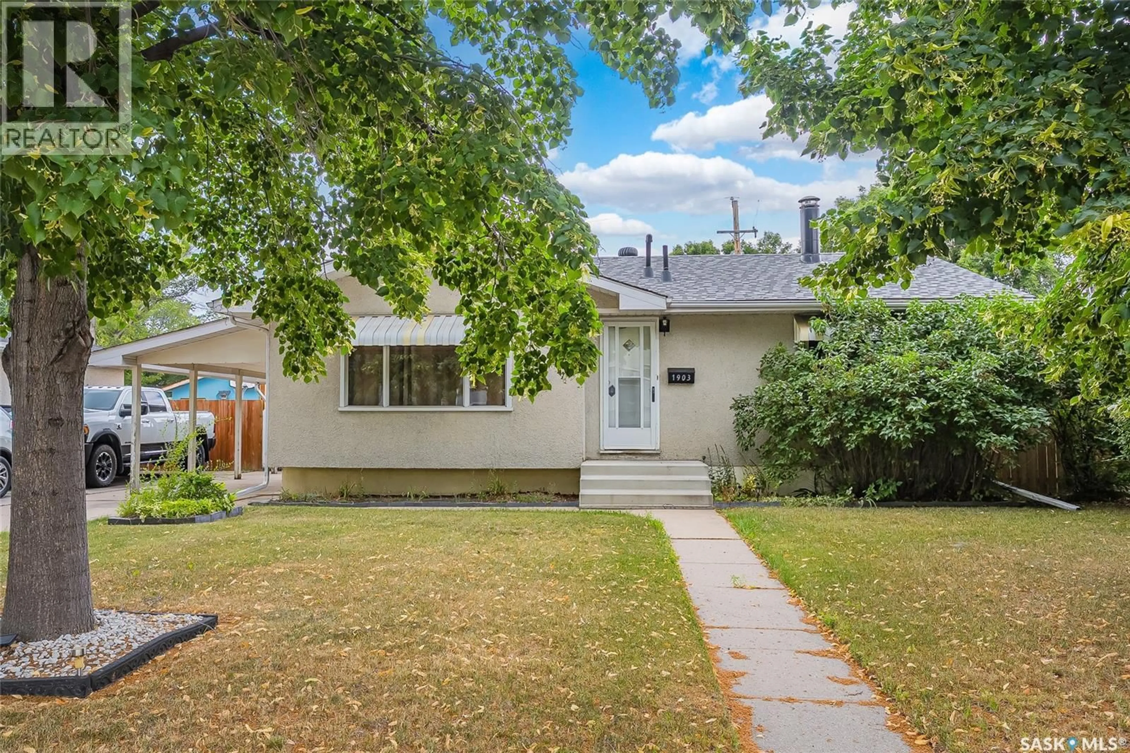 Home with vinyl exterior material, street for 1903 WILSON CRESCENT, Saskatoon Saskatchewan S7J2N8