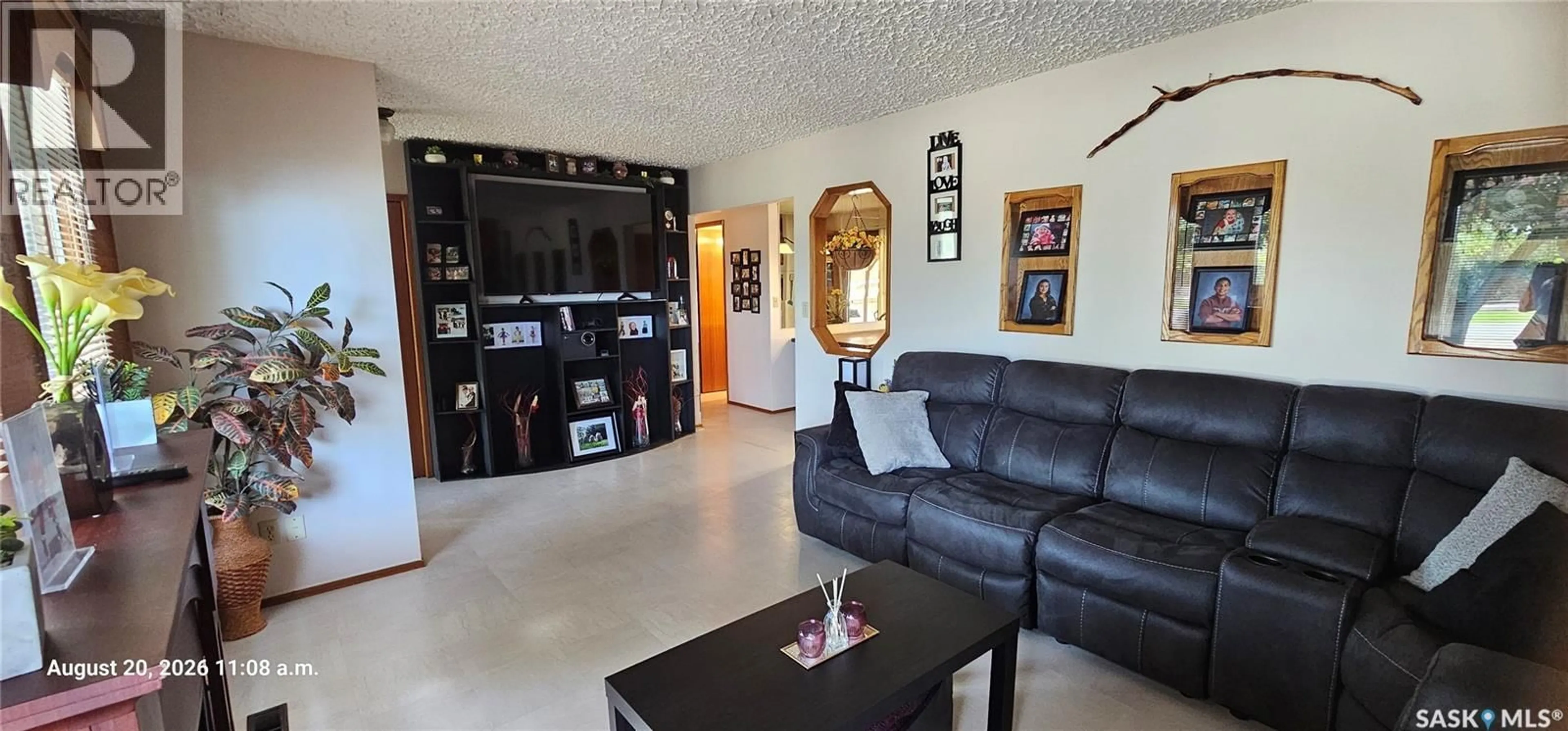 Living room with furniture, ceramic/tile floor for 713 1ST AVENUE, Cudworth Saskatchewan S0K1B0