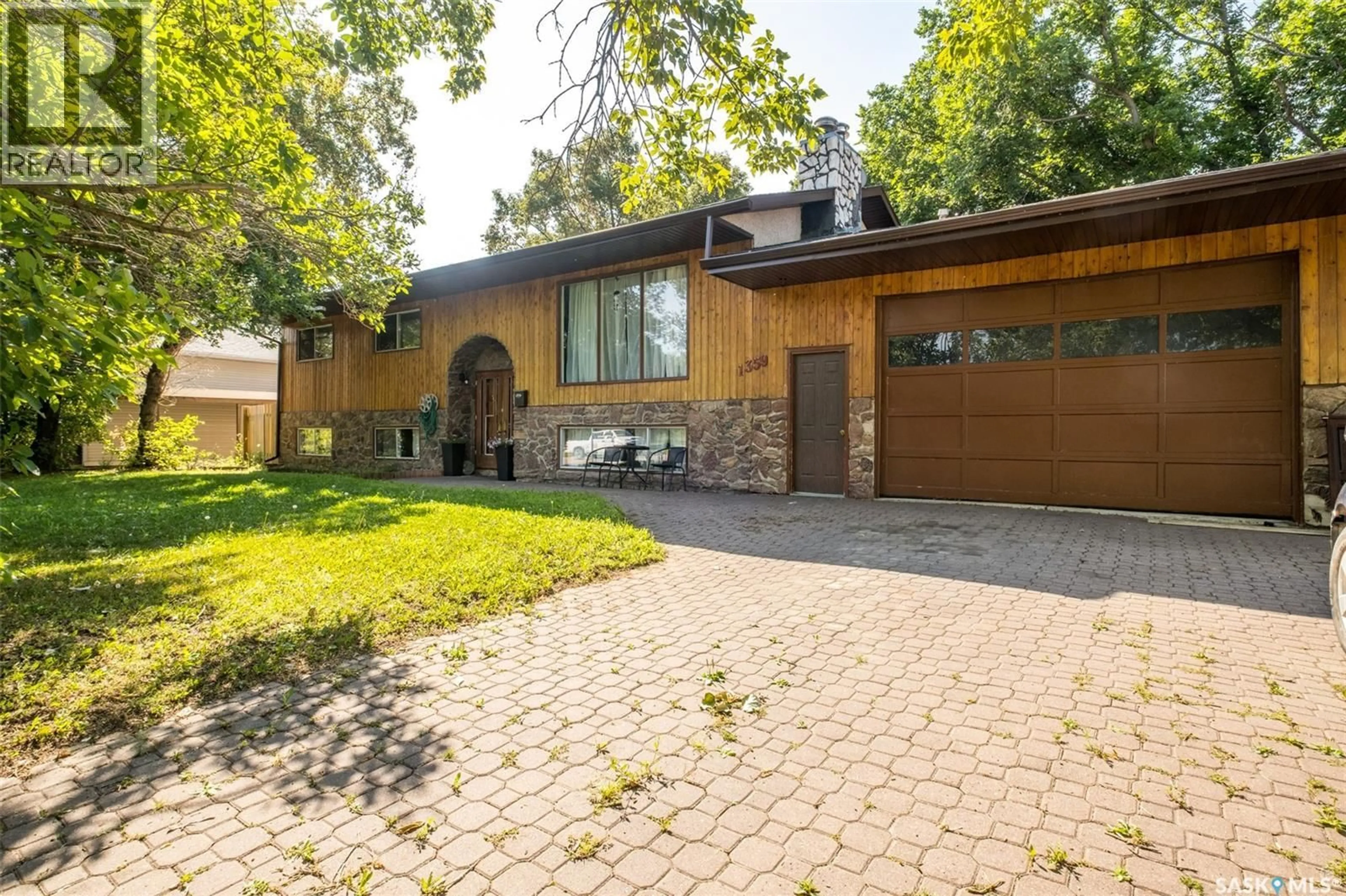 Home with brick exterior material, street for 1359 RIVER STREET, Prince Albert Saskatchewan S6V0B8