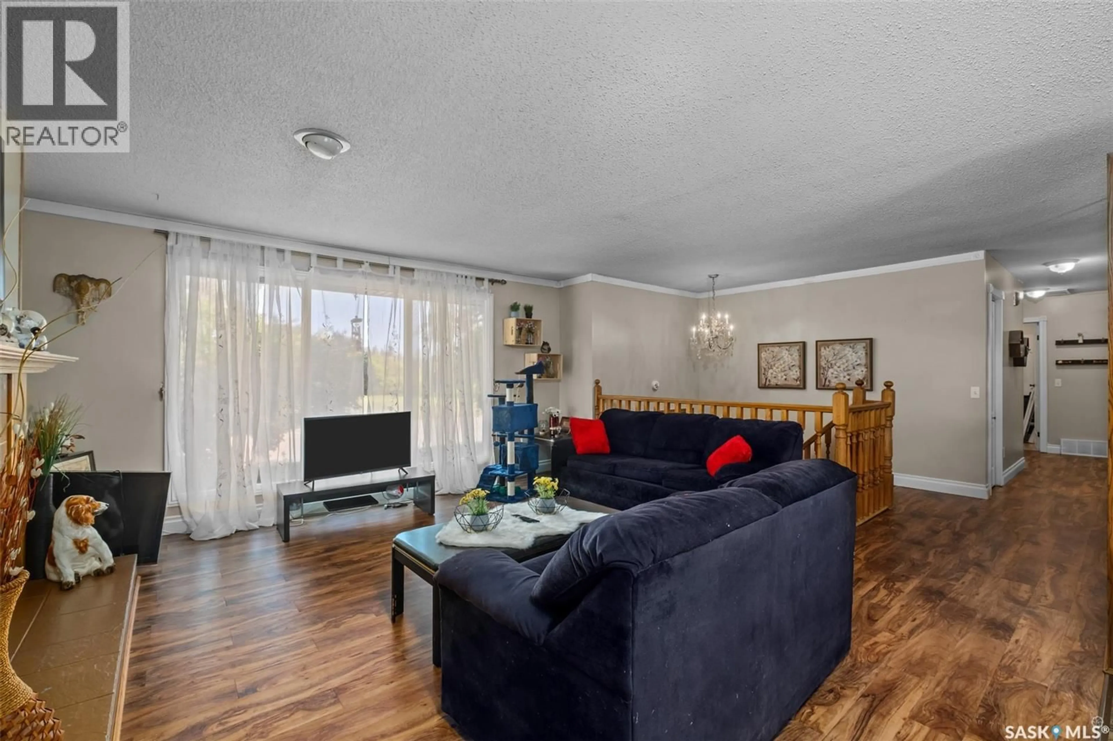 Living room with furniture, wood/laminate floor for 1359 RIVER STREET, Prince Albert Saskatchewan S6V0B8