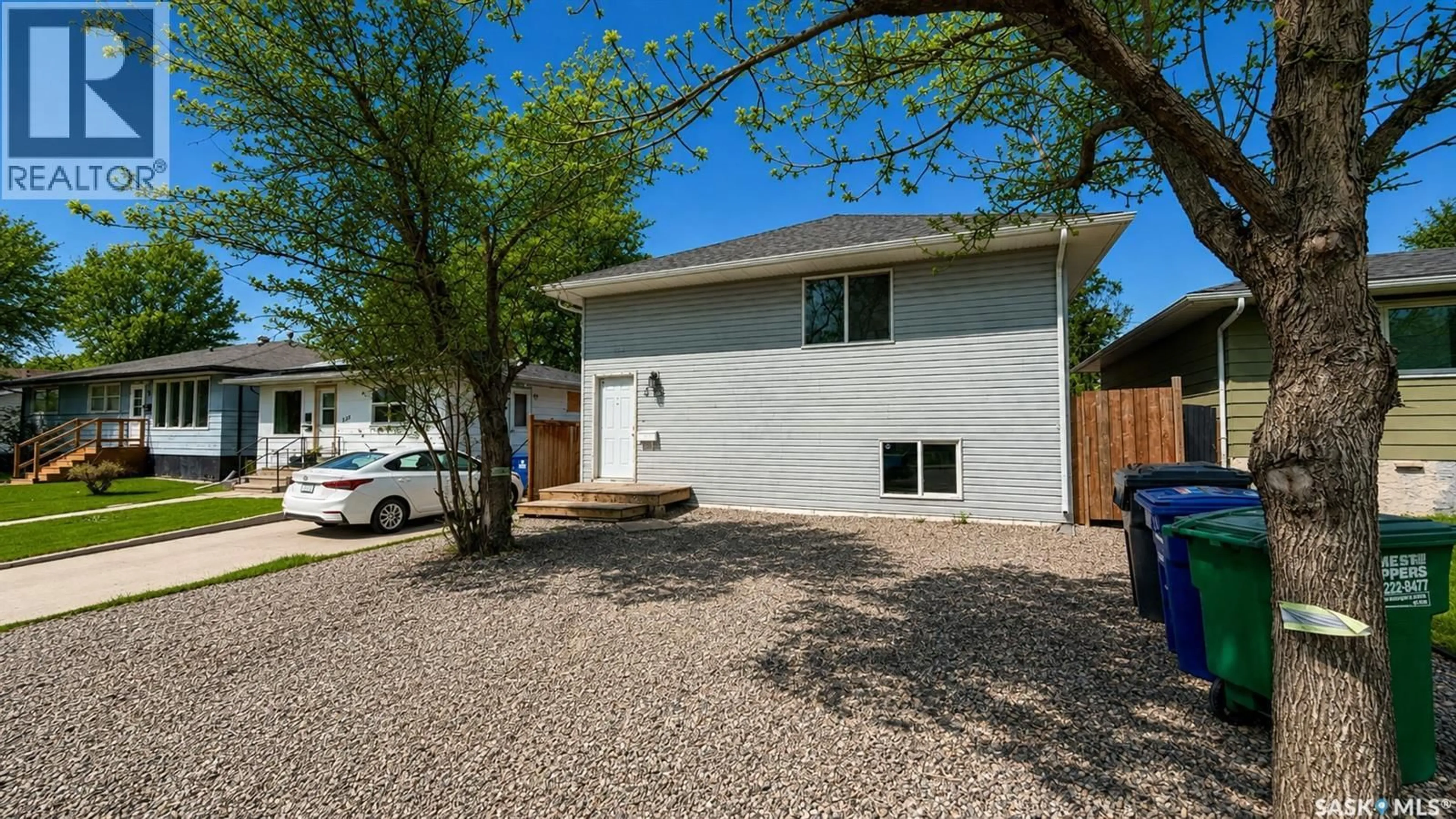 Home with vinyl exterior material, street for 215 V AVENUE, Saskatoon Saskatchewan S7L3E5