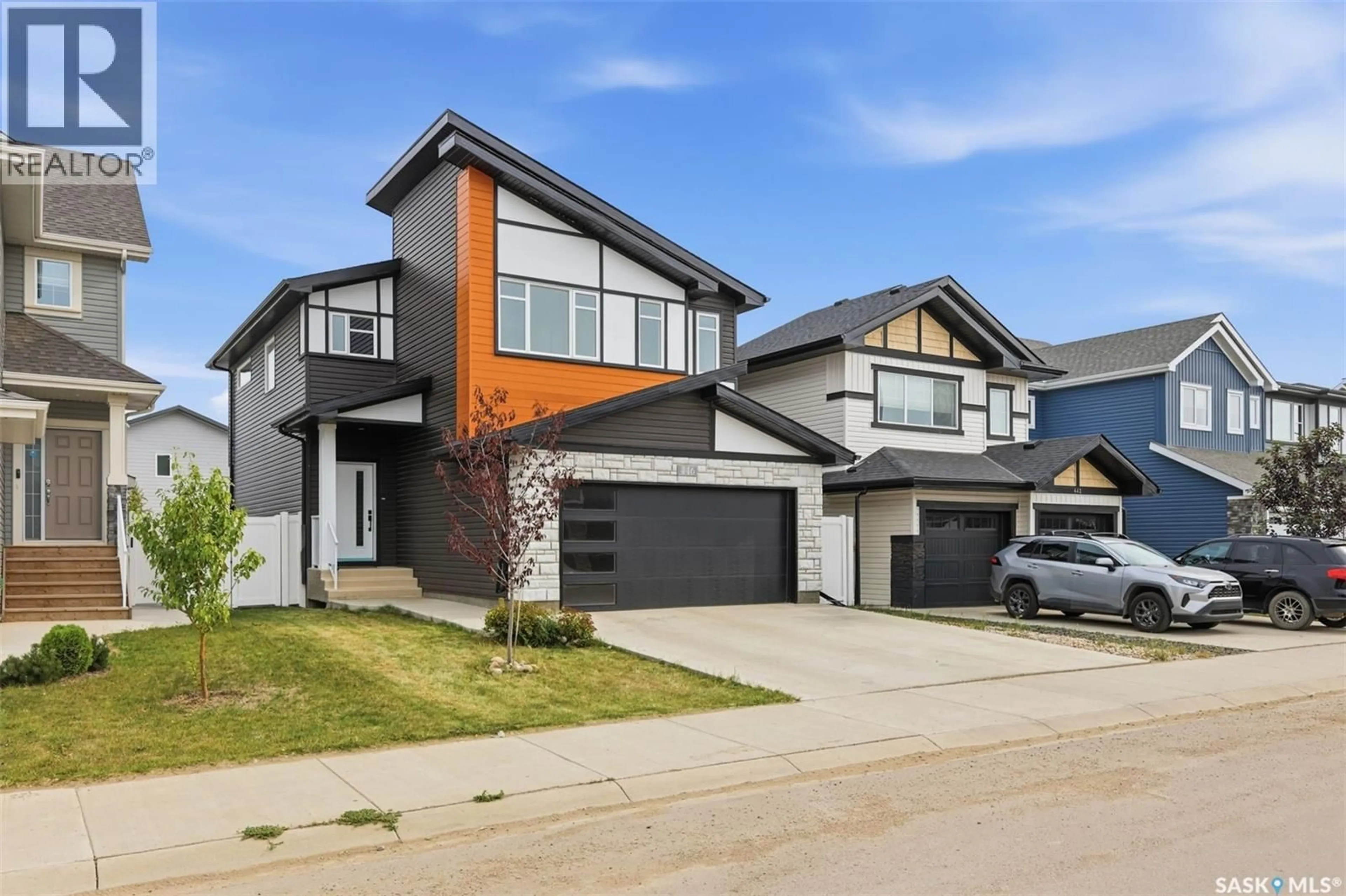 Home with brick exterior material, street for 446 ANISKOTAW WAY, Saskatoon Saskatchewan S7V1M3
