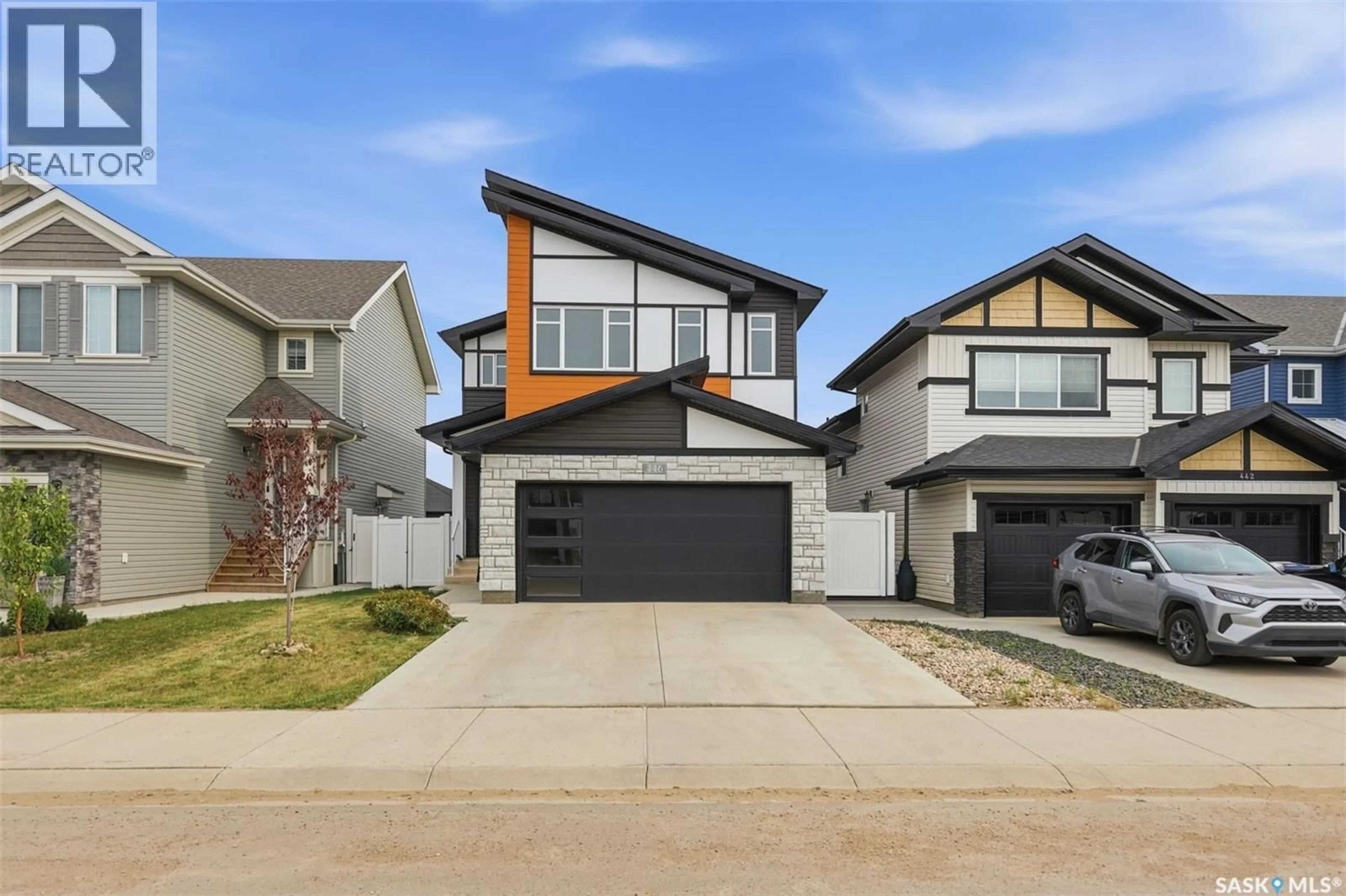 Home with vinyl exterior material, street for 446 ANISKOTAW WAY, Saskatoon Saskatchewan S7V1M3