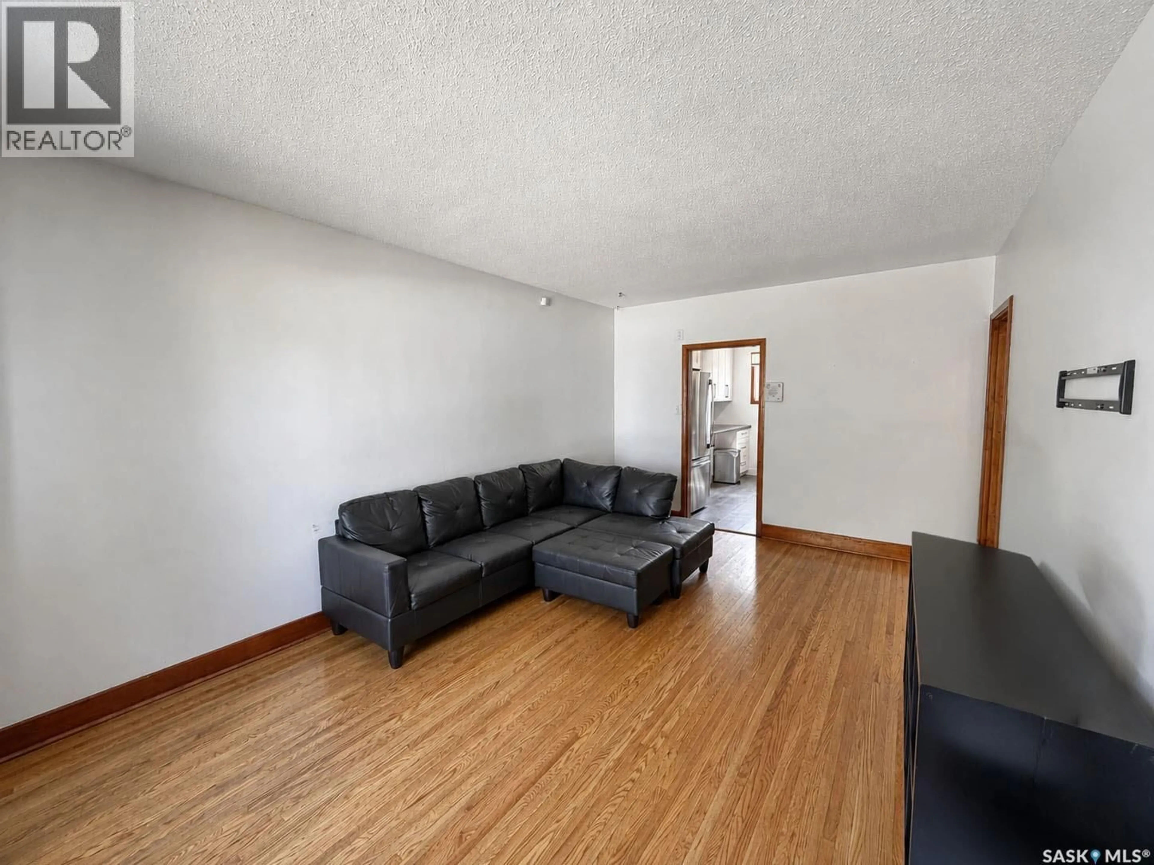 Living room with furniture, wood/laminate floor for 537 10TH STREET, Prince Albert Saskatchewan S6V0Z7
