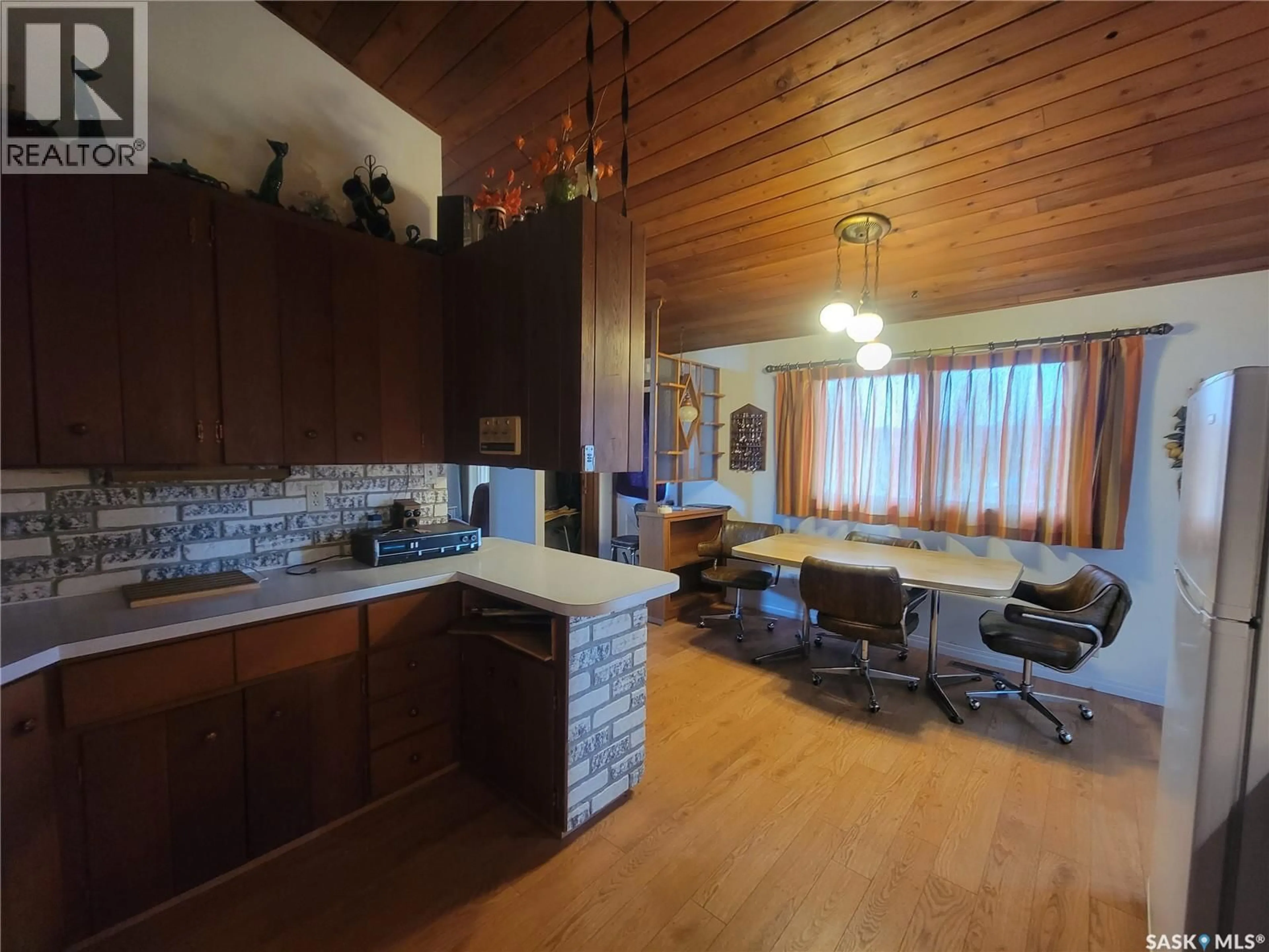 Open concept kitchen, wood/laminate floor for 509 3RD STREET, Wilkie Saskatchewan S0K4W0