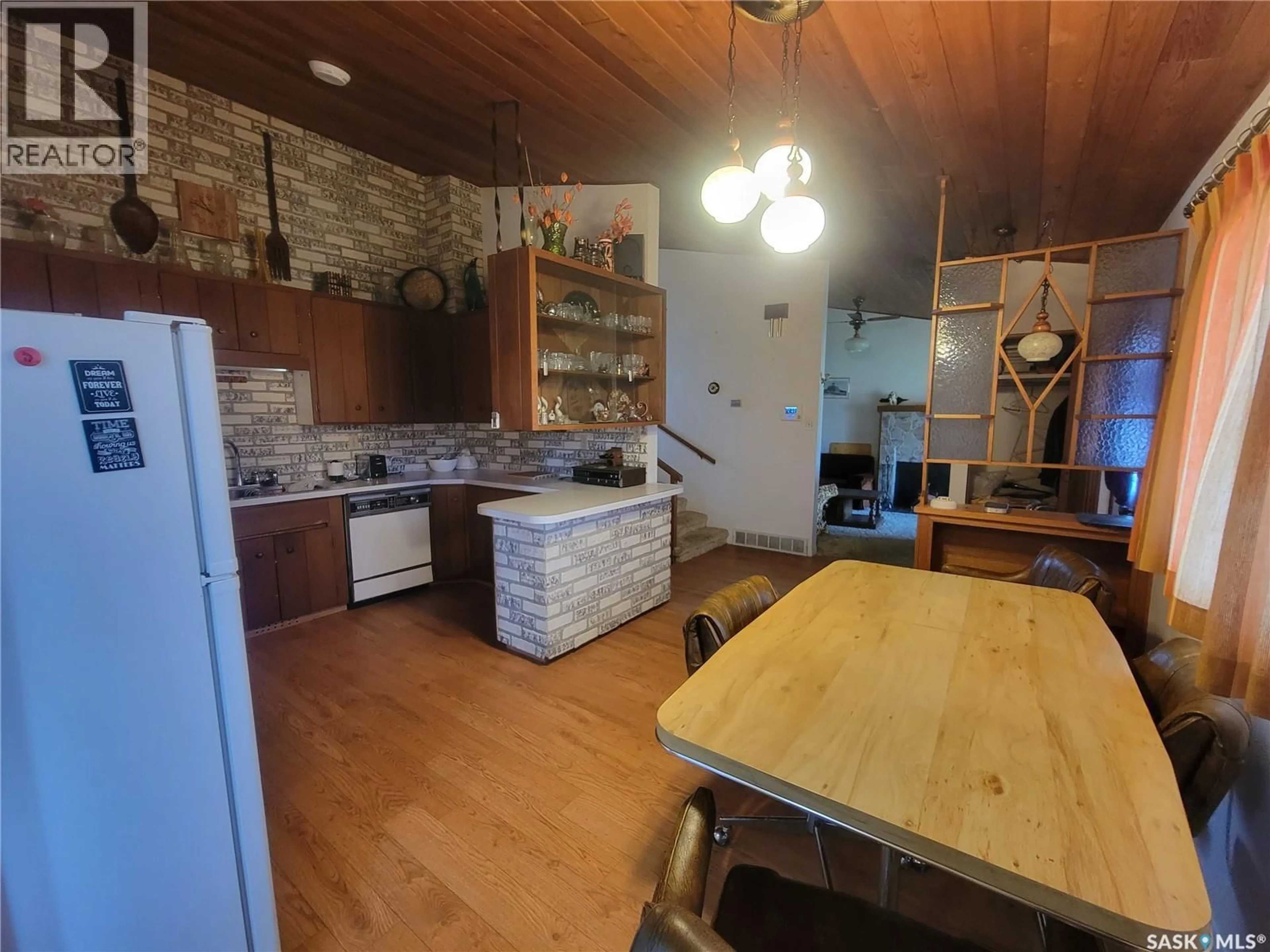 Open concept kitchen, wood/laminate floor for 509 3RD STREET, Wilkie Saskatchewan S0K4W0
