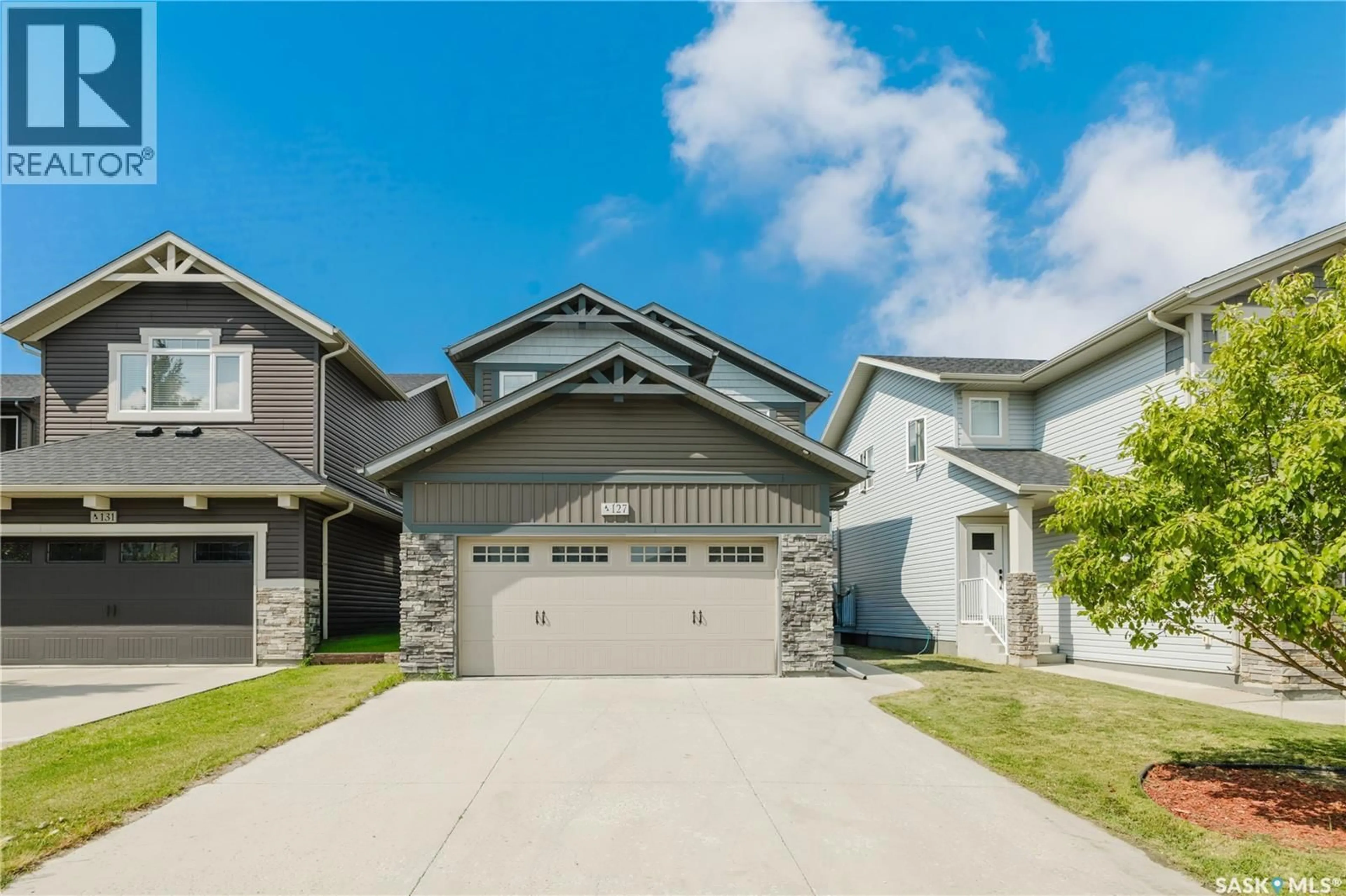 Home with vinyl exterior material, street for 127 DAGNONE LANE, Saskatoon Saskatchewan S7V0P6
