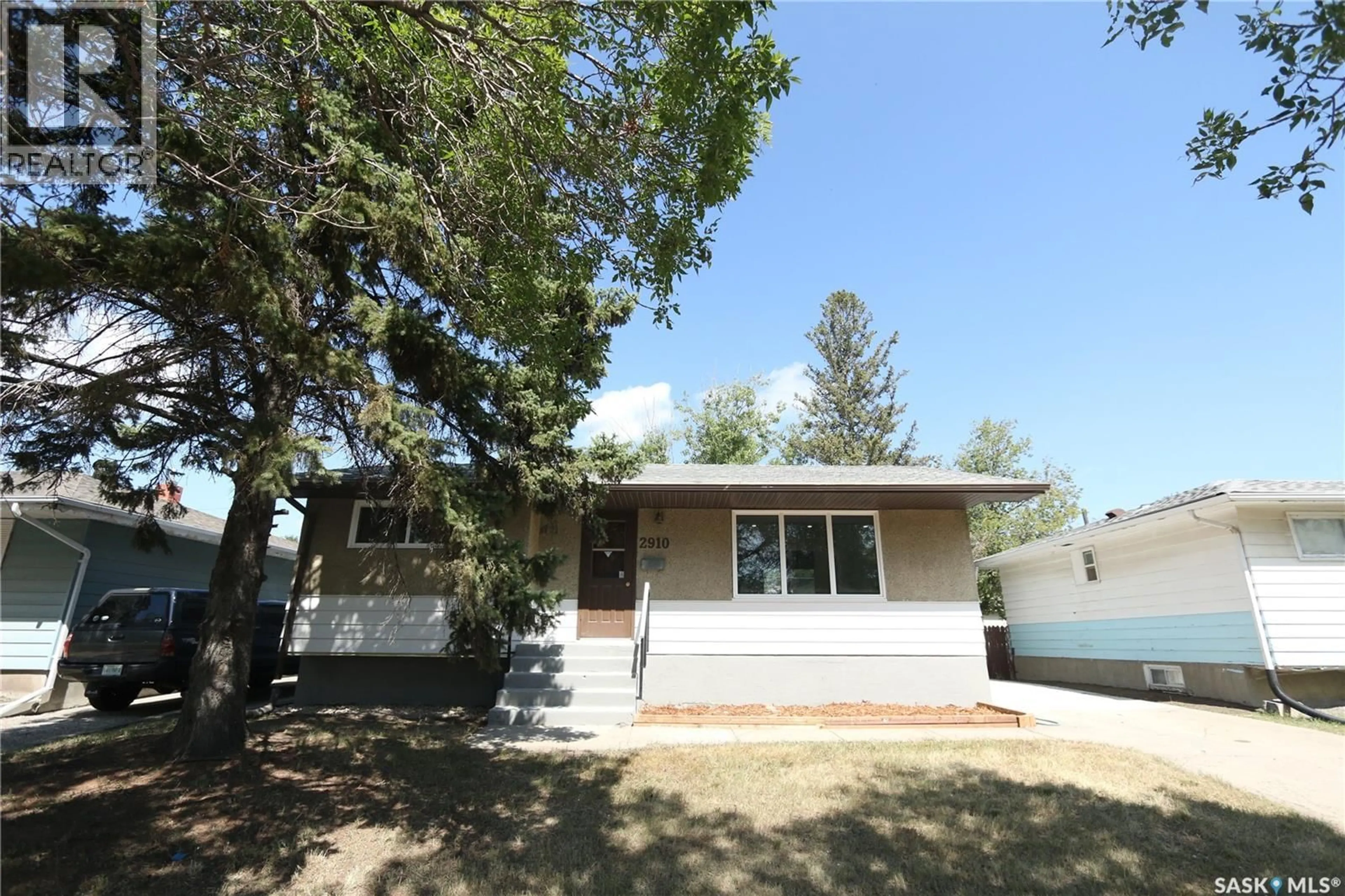 Home with vinyl exterior material, street for 2910 AVONHURST DRIVE, Regina Saskatchewan S4R3J5
