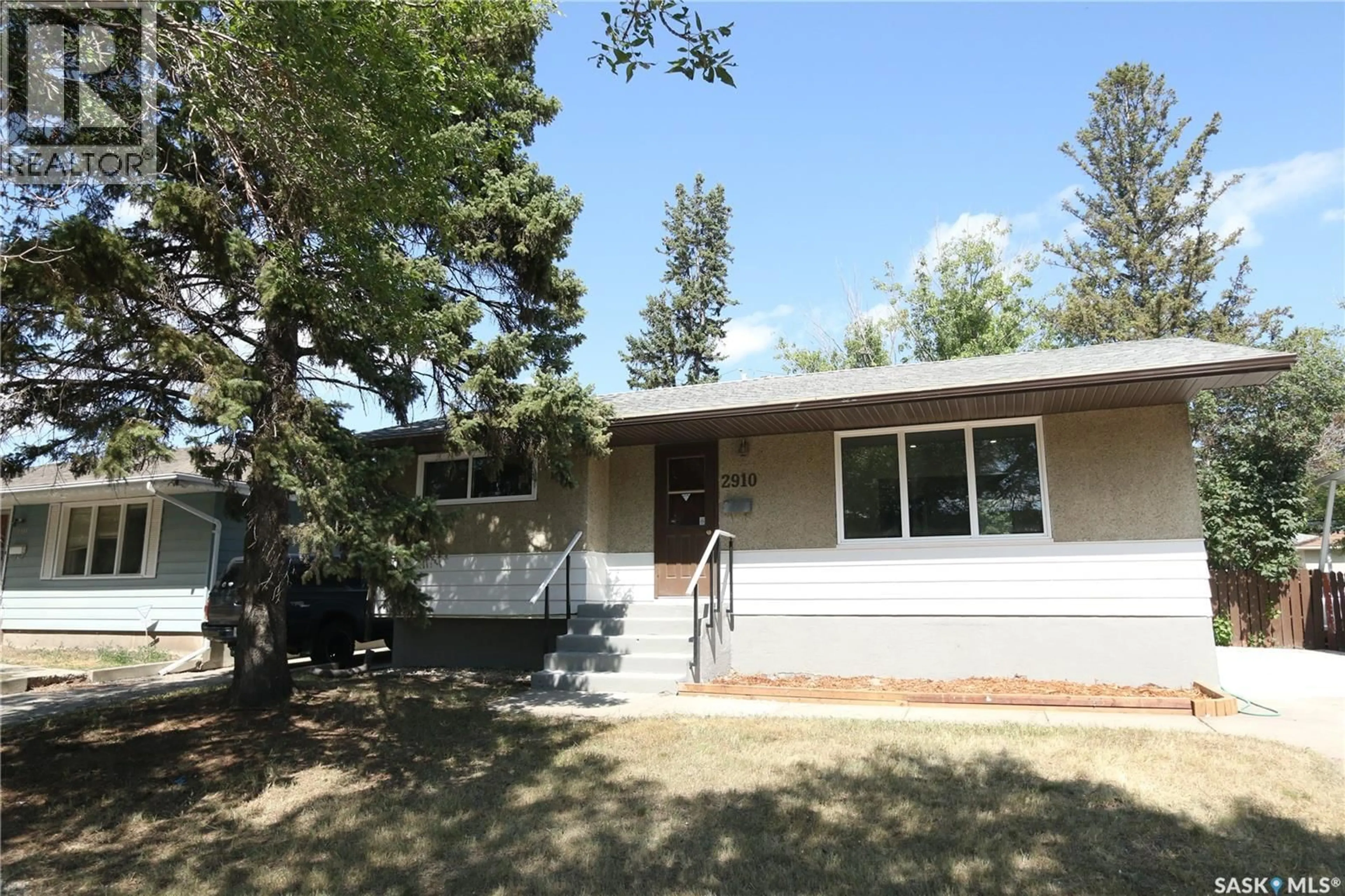 Home with vinyl exterior material, street for 2910 AVONHURST DRIVE, Regina Saskatchewan S4R3J5