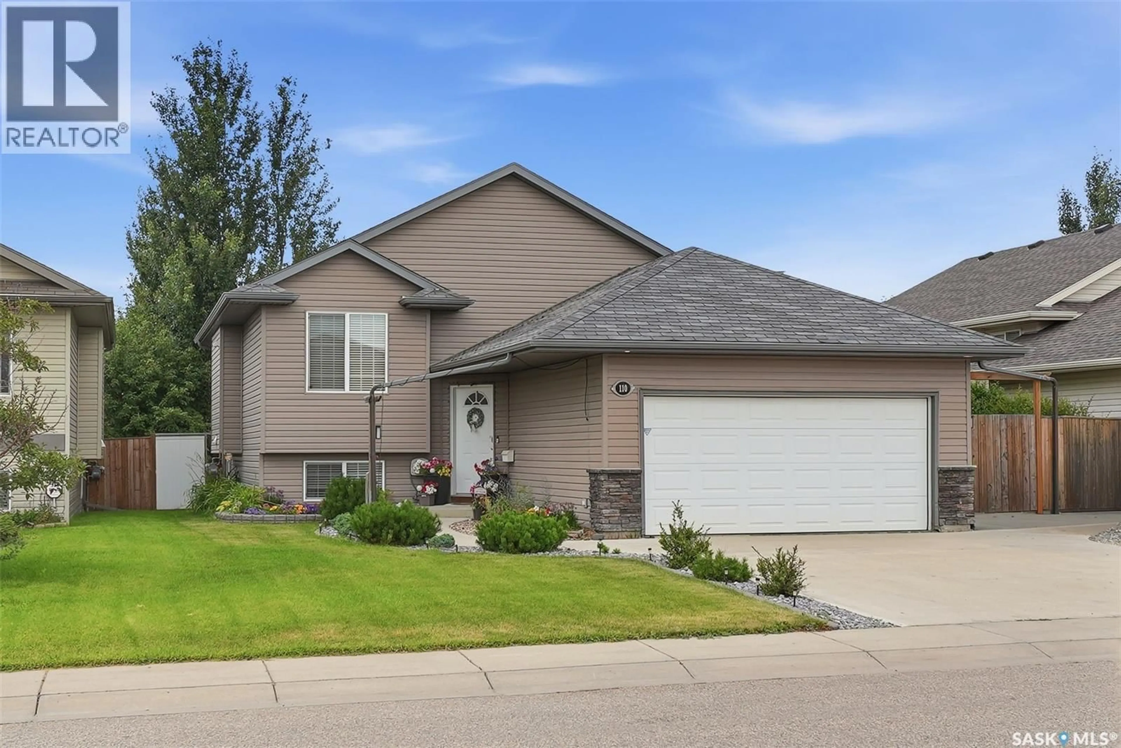Home with vinyl exterior material, street for 110 BENNION CRESCENT, Saskatoon Saskatchewan S7W0H1