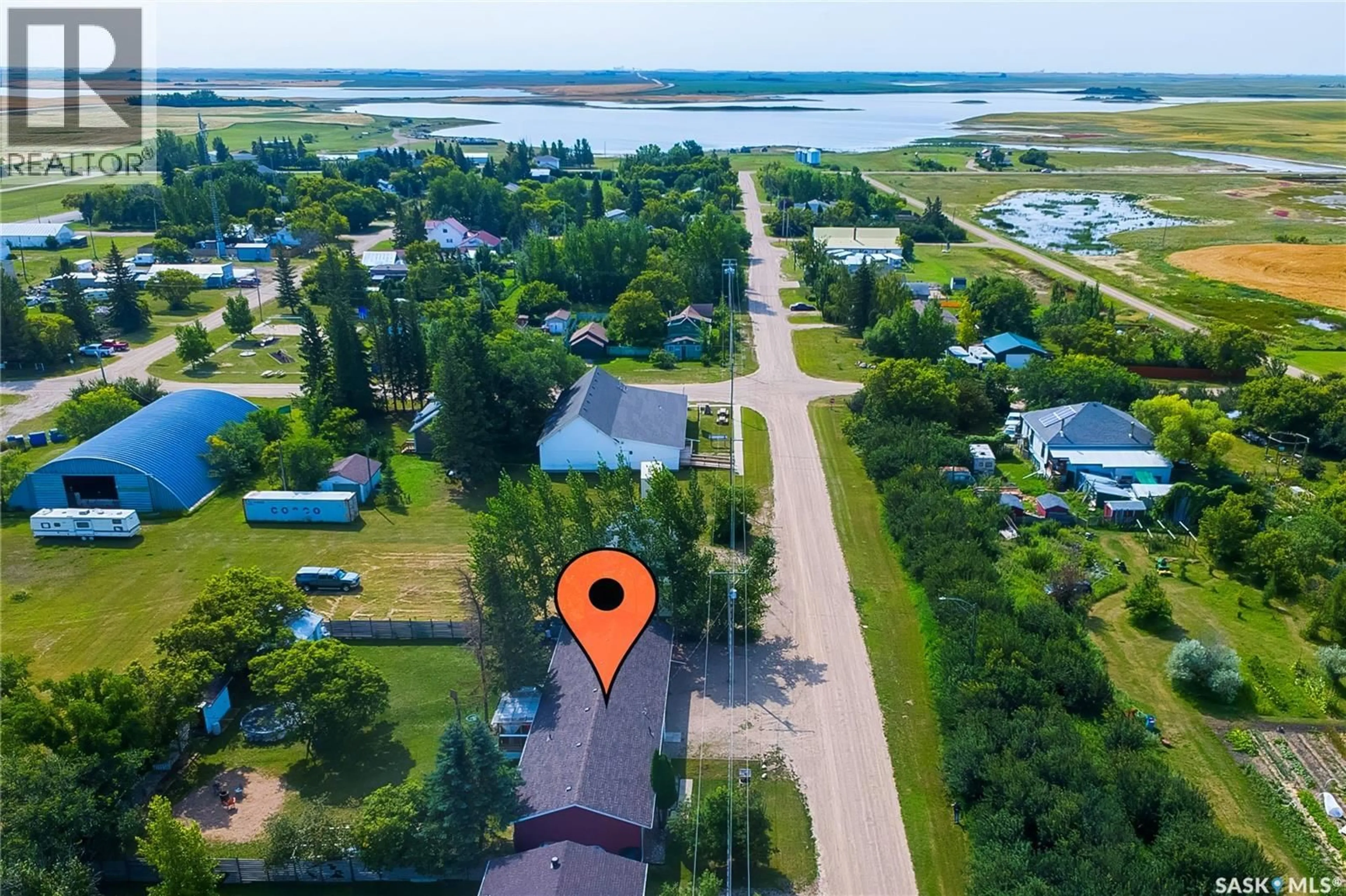 A pic from outside/outdoor area/front of a property/back of a property/a pic from drone, water/lake/river/ocean view for 316 3RD AVENUE, Meacham Saskatchewan S0K2V0