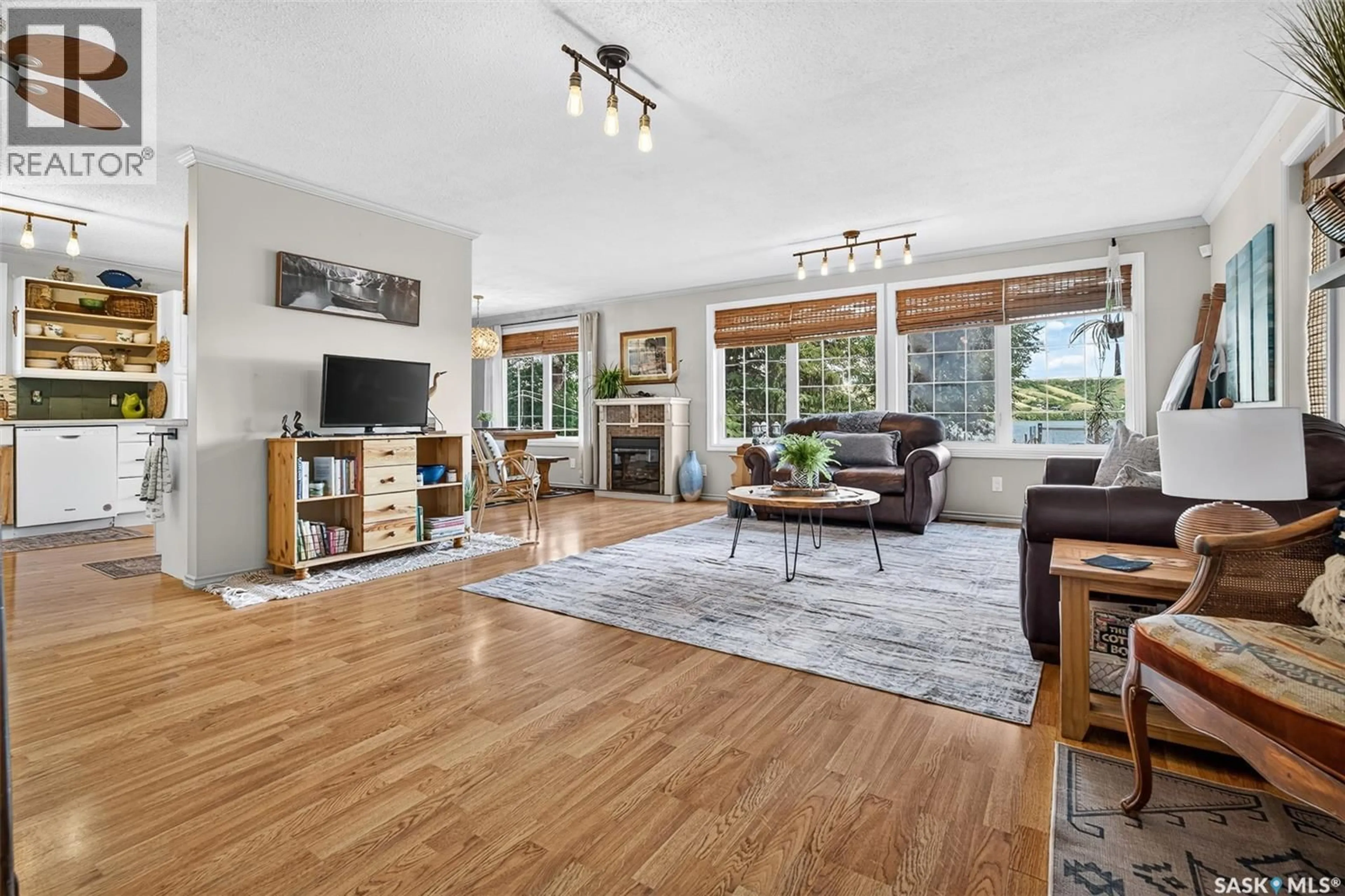 Living room with furniture, wood/laminate floor for 101-109 SAND POINT ROAD, Buffalo Pound Lake Saskatchewan S0G4C0