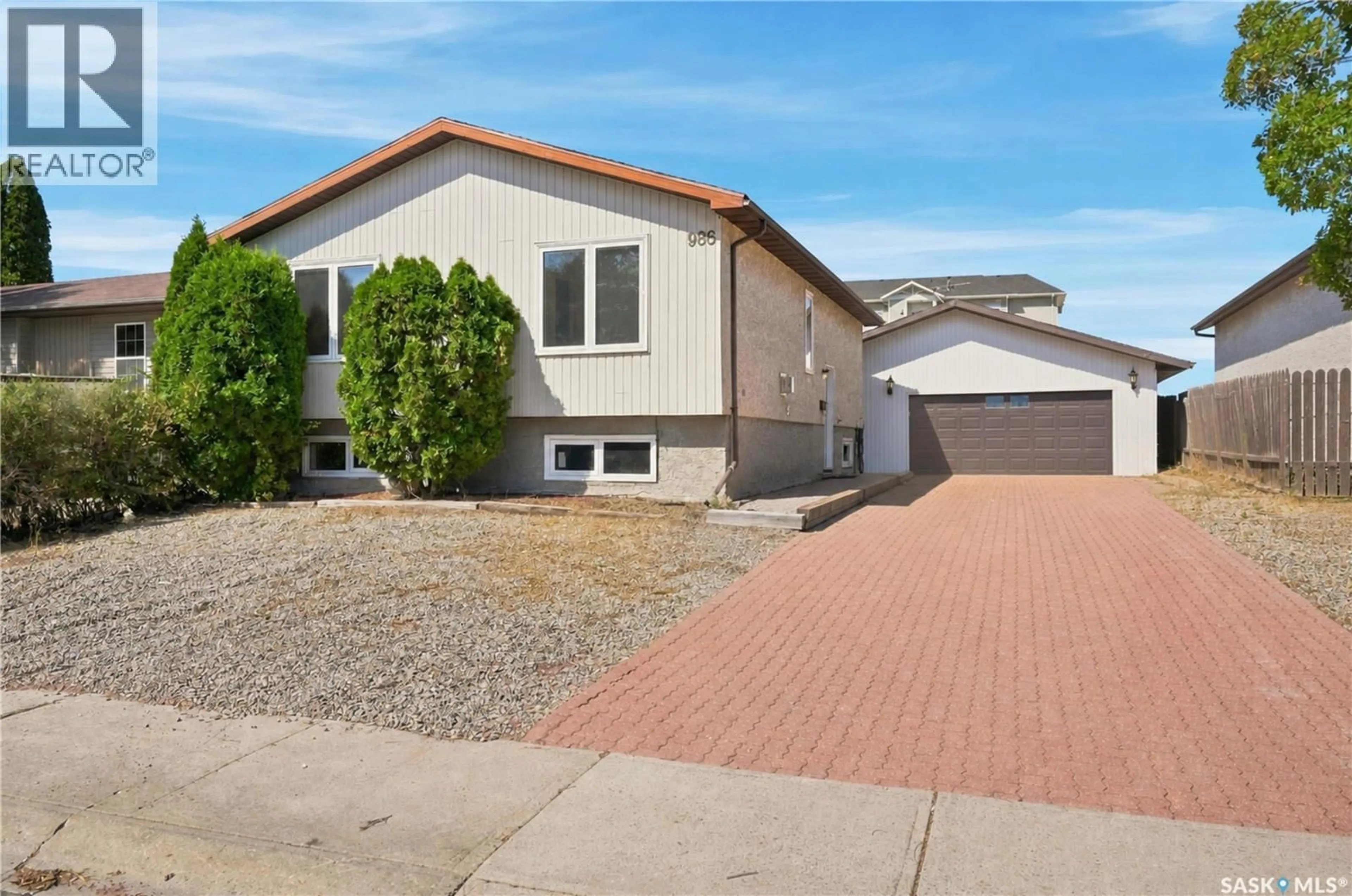 Home with vinyl exterior material, street for 986 ROWELL CRESCENT, Regina Saskatchewan S4X2A6