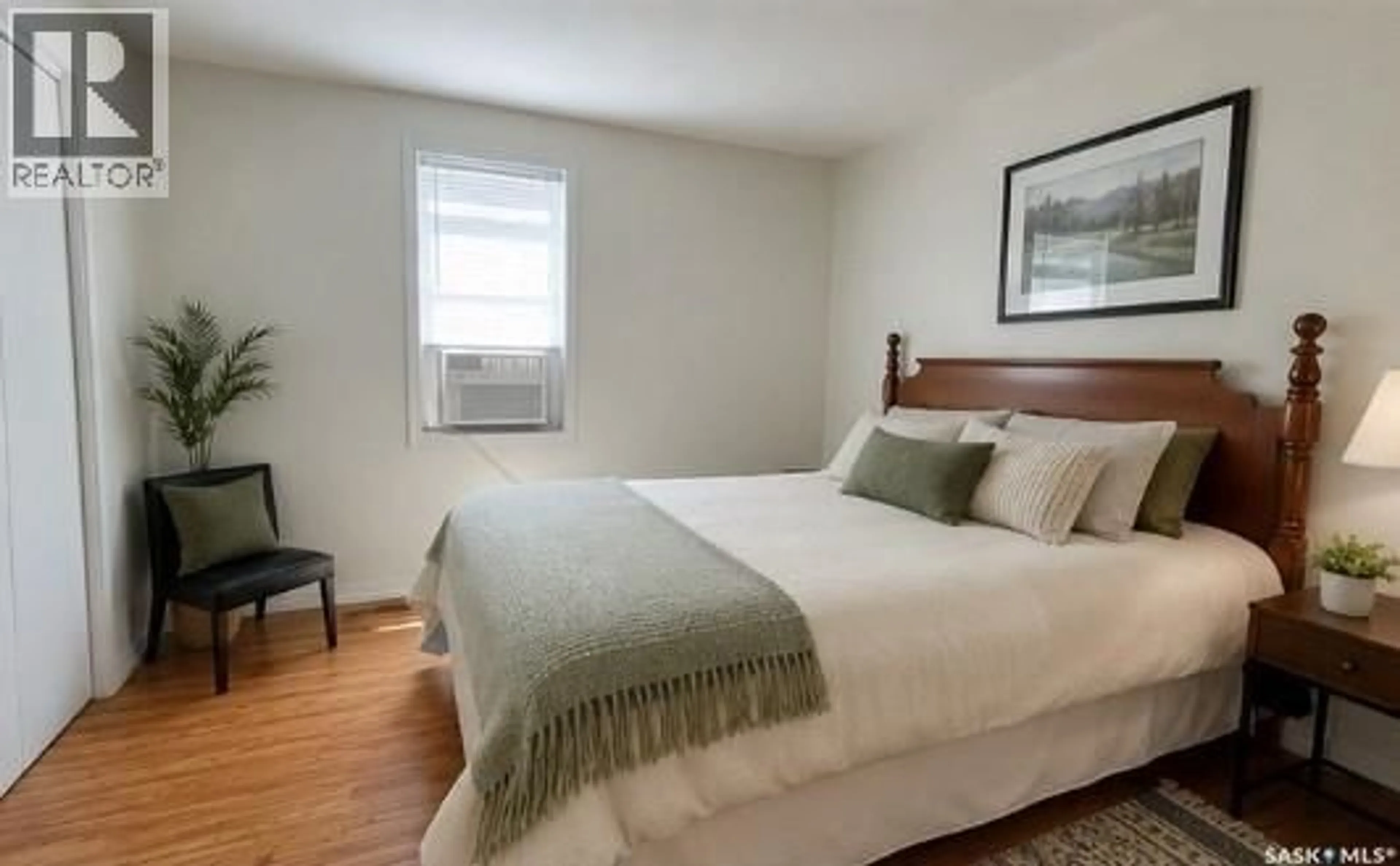 Bedroom with bed, wood/laminate floor for 118 1ST STREET, St. Walburg Saskatchewan S0M2T0