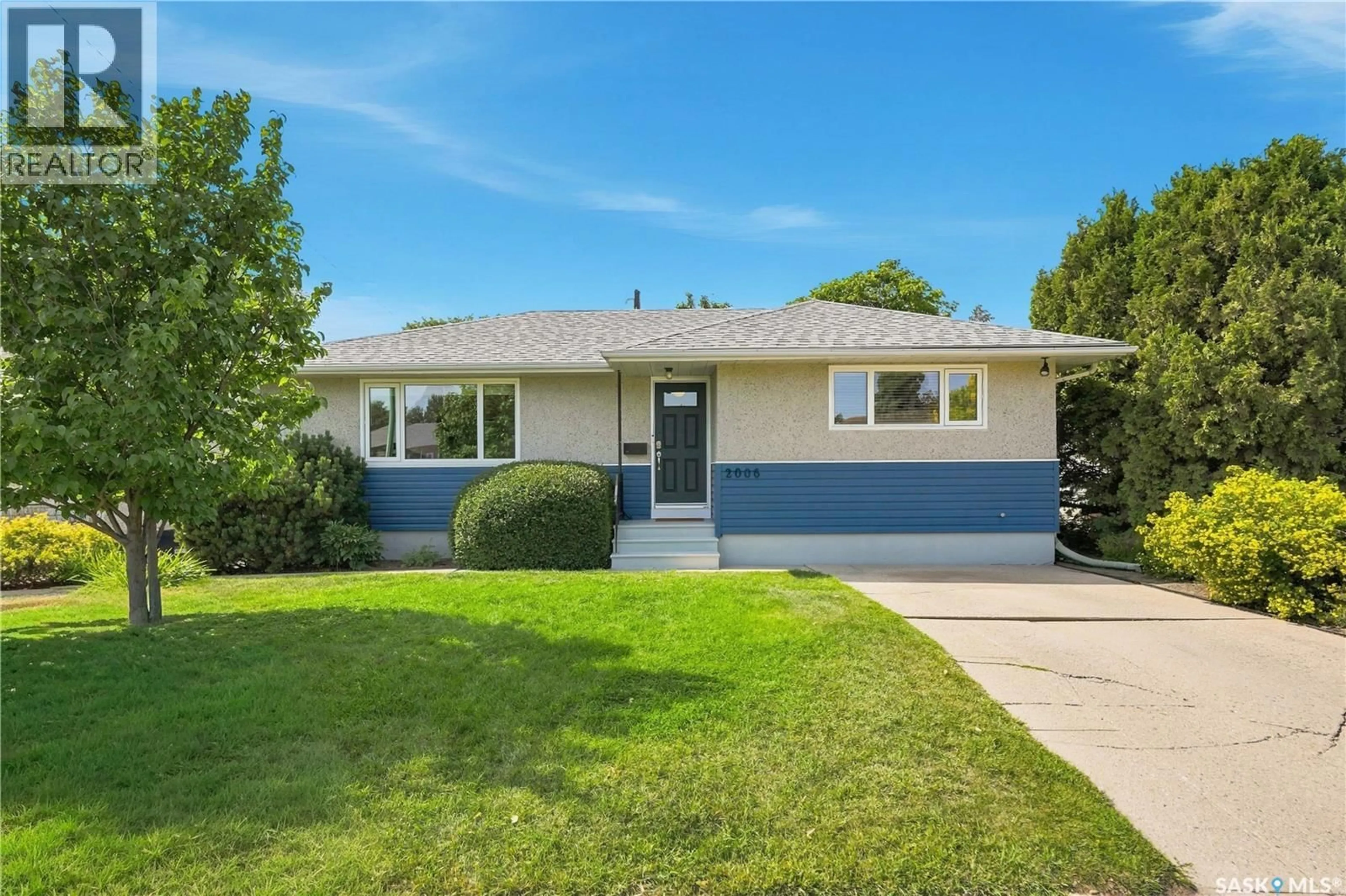 Home with vinyl exterior material, street for 2006 LOUISE AVENUE, Saskatoon Saskatchewan S7J2C2