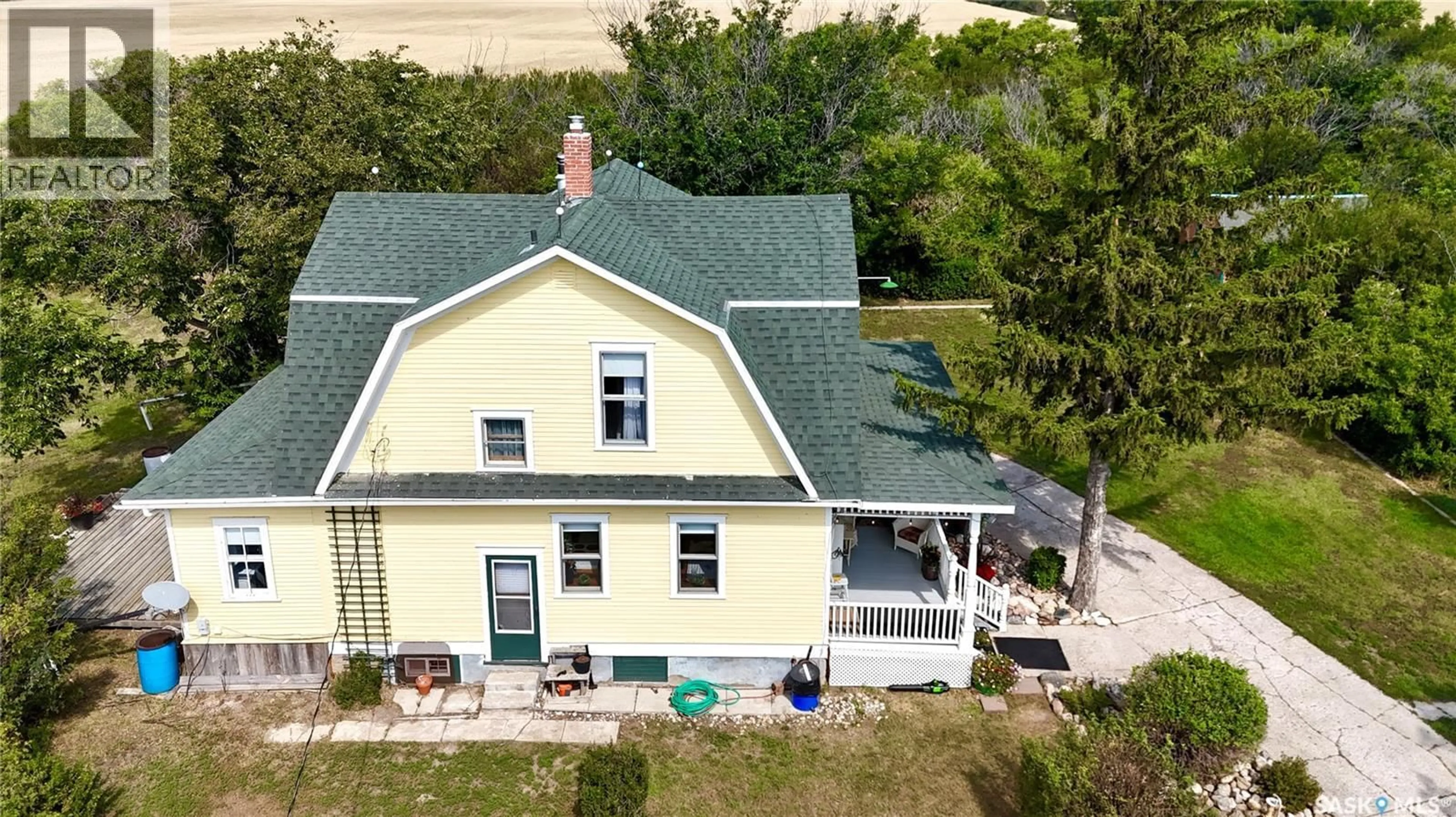 A pic from outside/outdoor area/front of a property/back of a property/a pic from drone, building for WISETON ACREAGE, Milden Rm No. 286 Saskatchewan S0L3M0