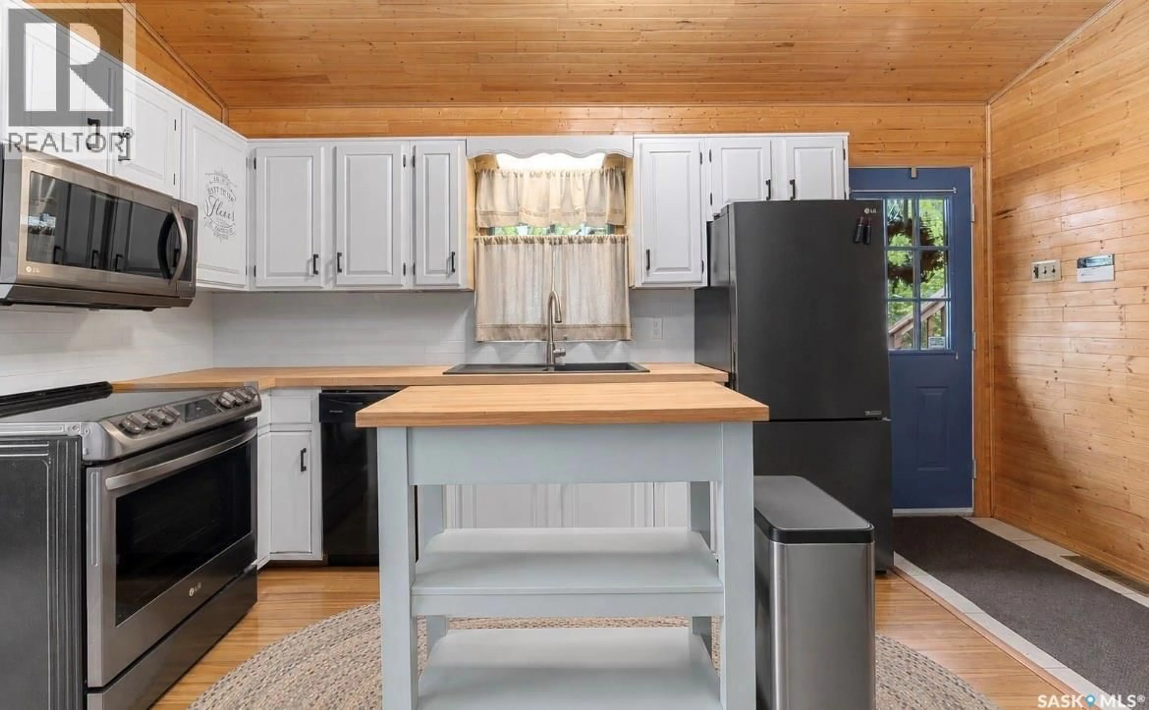 Open concept kitchen, wood/laminate floor for 315 BYNG AVENUE, Wakaw Lake Saskatchewan S0K4P0