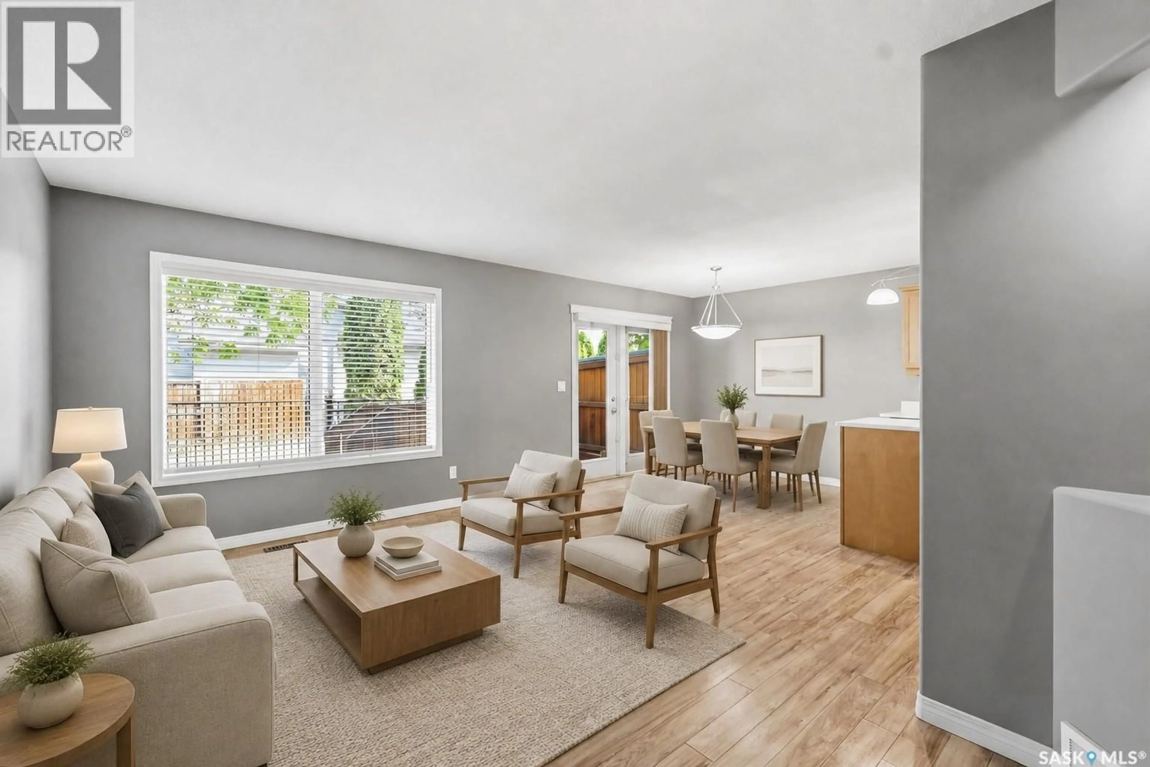 Living room with furniture, wood/laminate floor for 7 110 DULMAGE CRESCENT, Saskatoon Saskatchewan S7T0C7