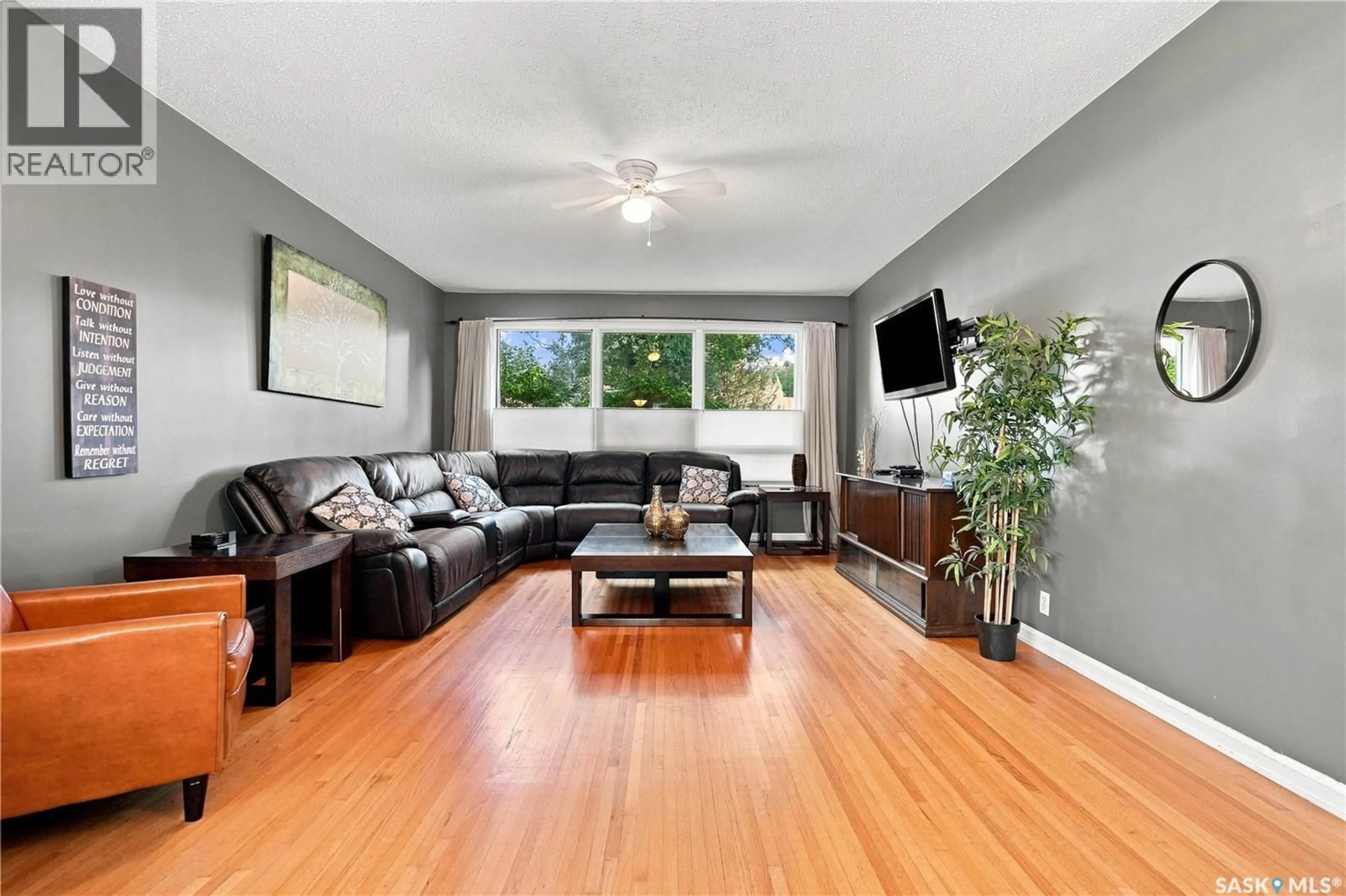 Living room with furniture, wood/laminate floor for 1626 UHRICH AVENUE, Regina Saskatchewan S4S4R5