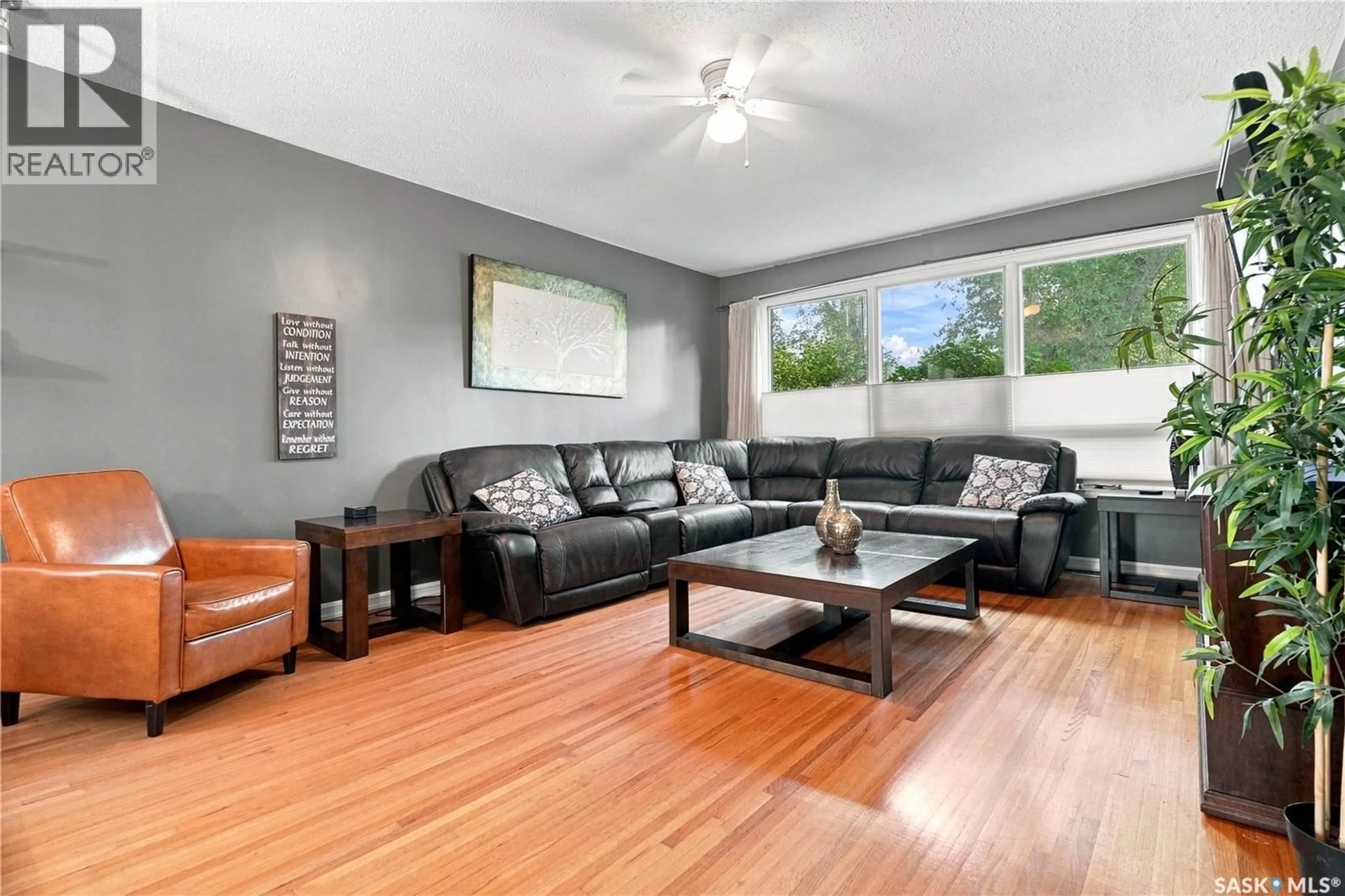 Living room with furniture, wood/laminate floor for 1626 UHRICH AVENUE, Regina Saskatchewan S4S4R5