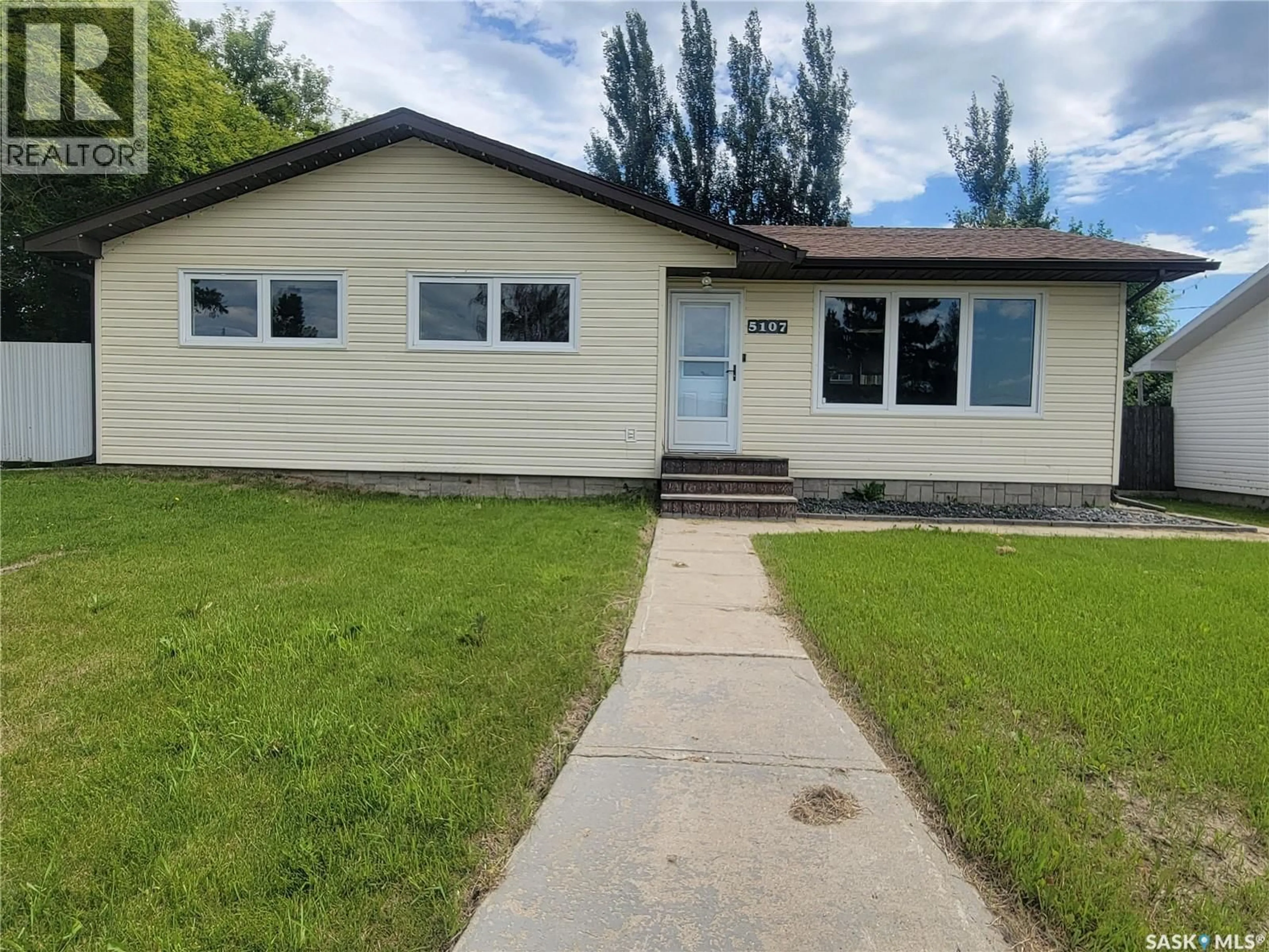 Home with vinyl exterior material, street for 5107 LEADER STREET, Macklin Saskatchewan S0L2C0
