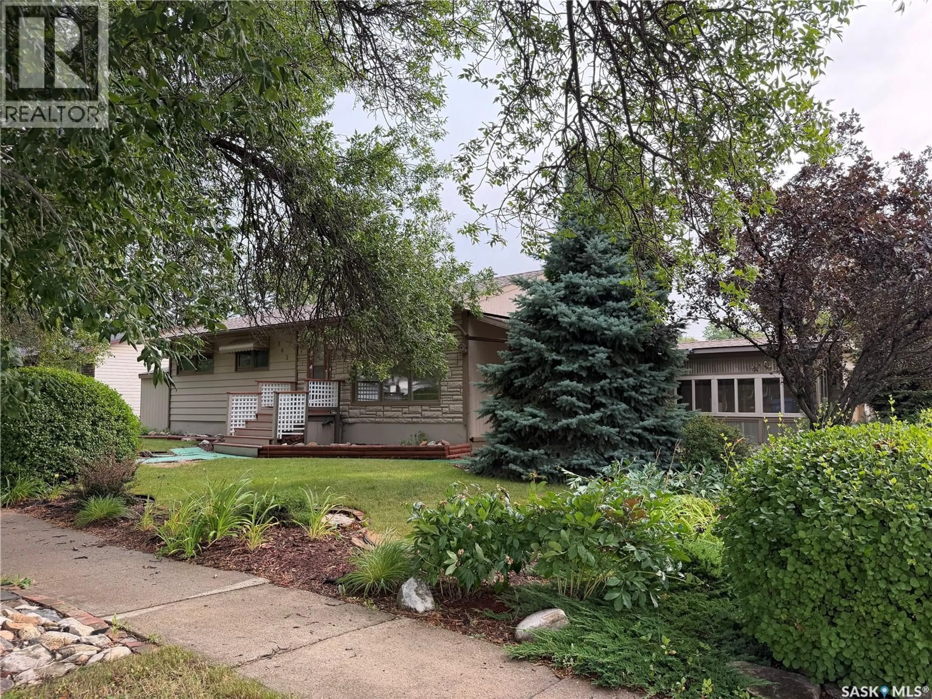 Home with vinyl exterior material, street for 302 BEMFORD STREET, Melfort Saskatchewan S0E1A0