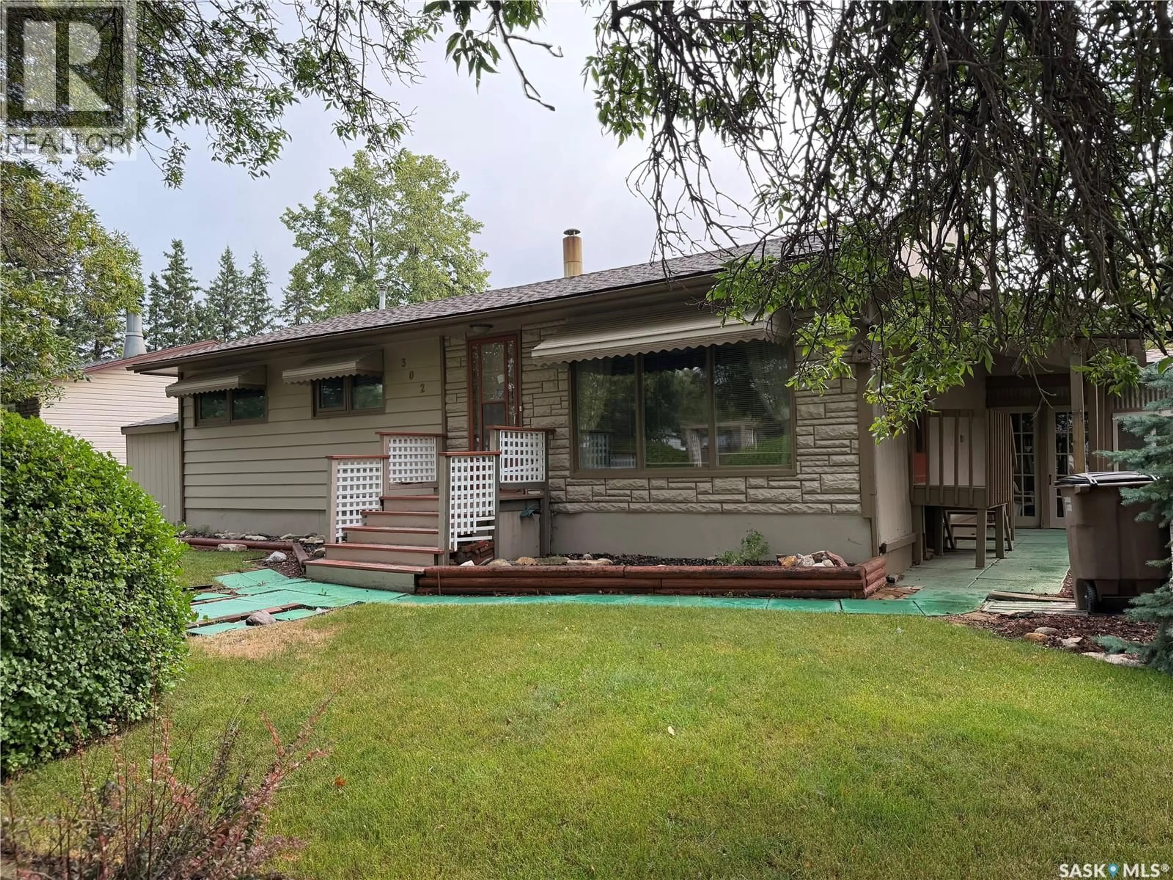 Home with vinyl exterior material, street for 302 BEMFORD STREET, Melfort Saskatchewan S0E1A0