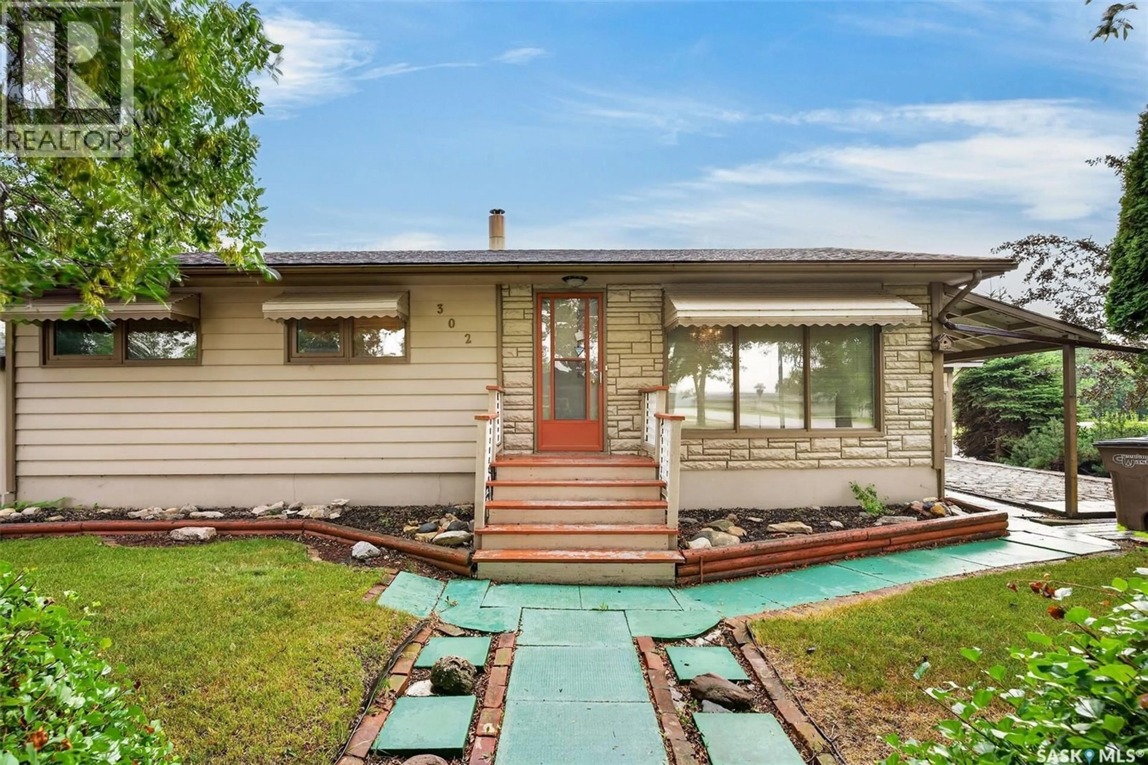 Home with vinyl exterior material, street for 302 BEMFORD STREET, Melfort Saskatchewan S0E1A0