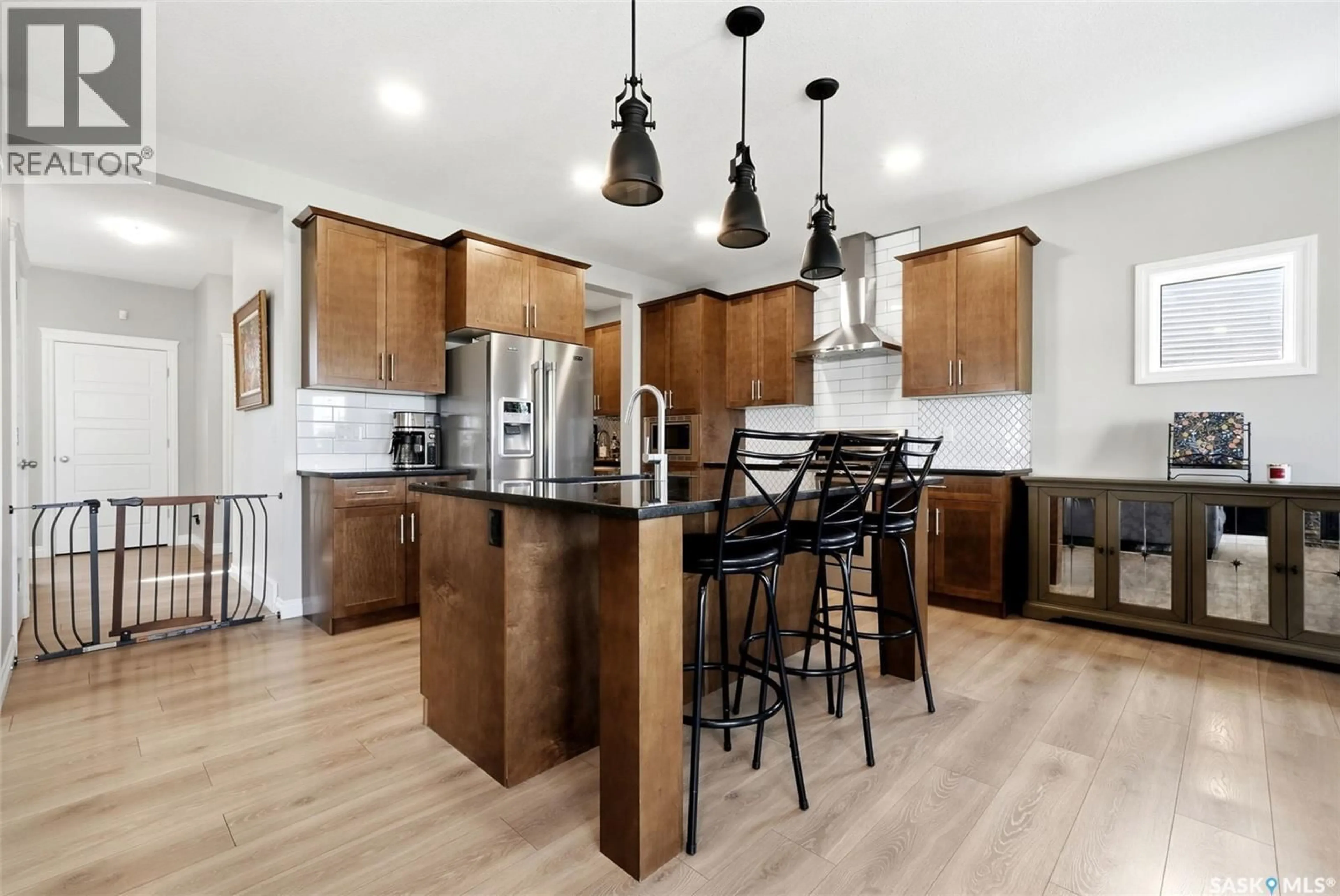 Open concept kitchen, wood/laminate floor for 5148 GREEN CRESCENT, Regina Saskatchewan S4V3S9