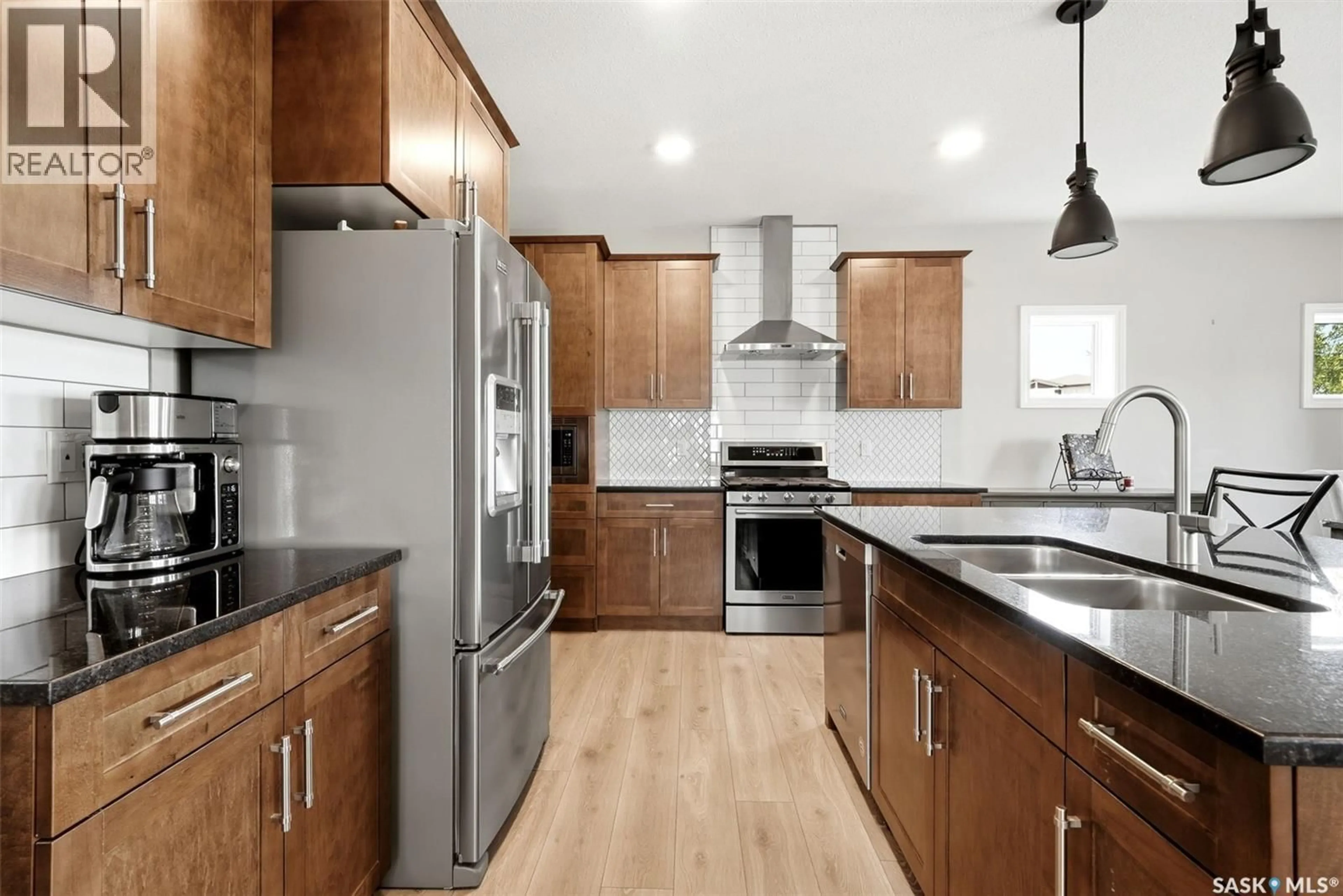Open concept kitchen, wood/laminate floor for 5148 GREEN CRESCENT, Regina Saskatchewan S4V3S9