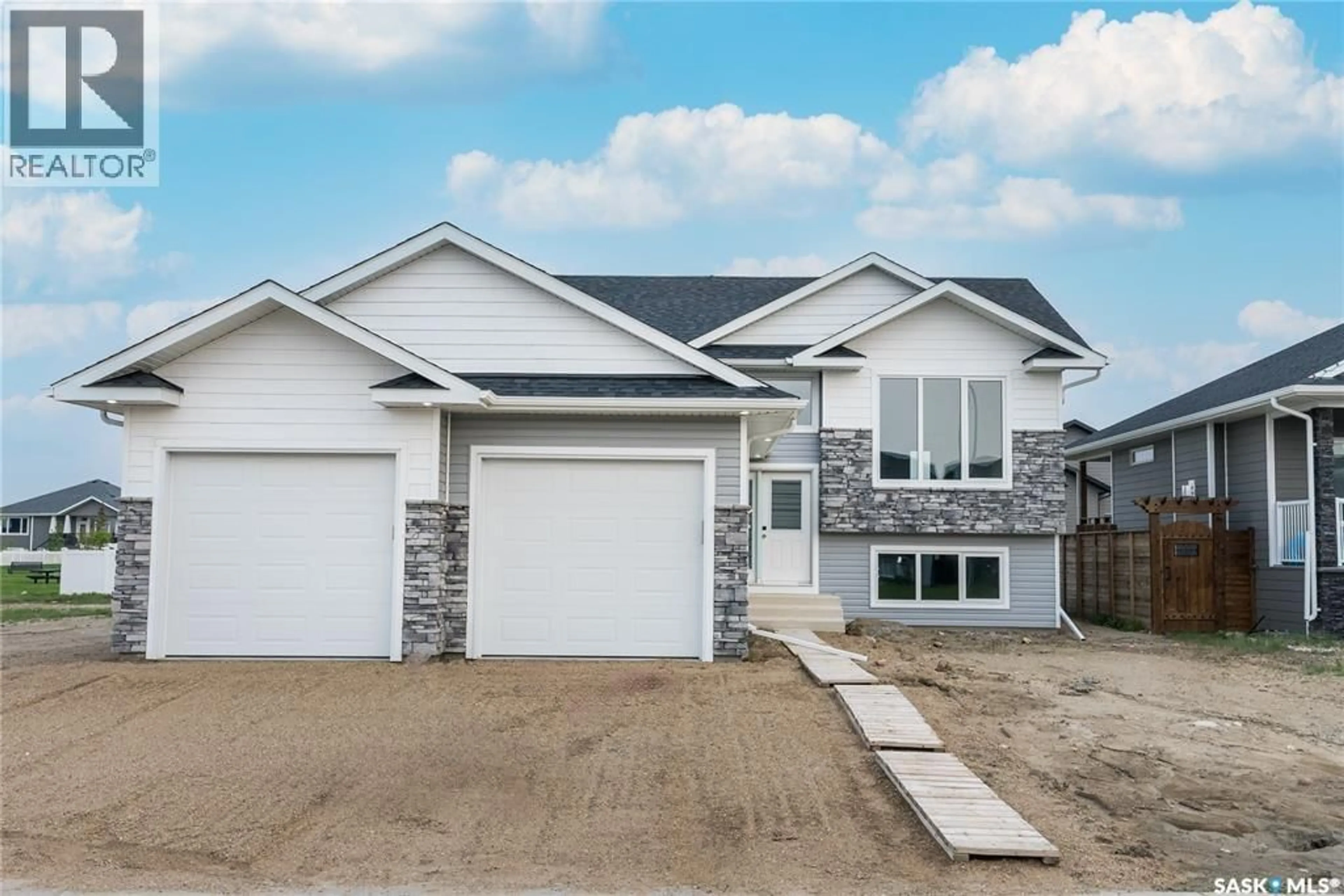Home with vinyl exterior material, street for 804 BALLESTEROS CRESCENT, Warman Saskatchewan S0K4S0