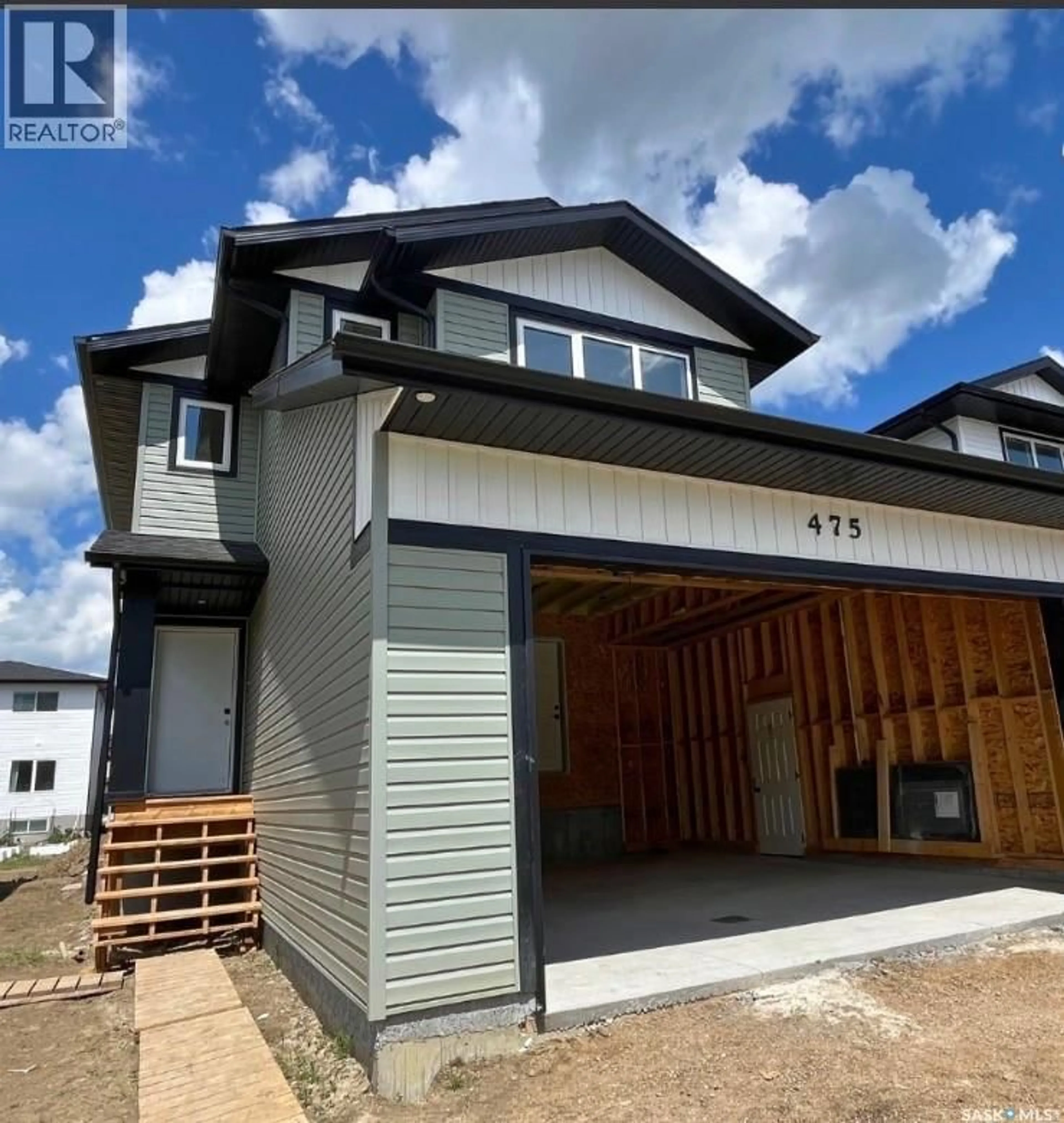 Home with vinyl exterior material, street for 475 TRAEGER CLOSE, Saskatoon Saskatchewan S7V1Z5