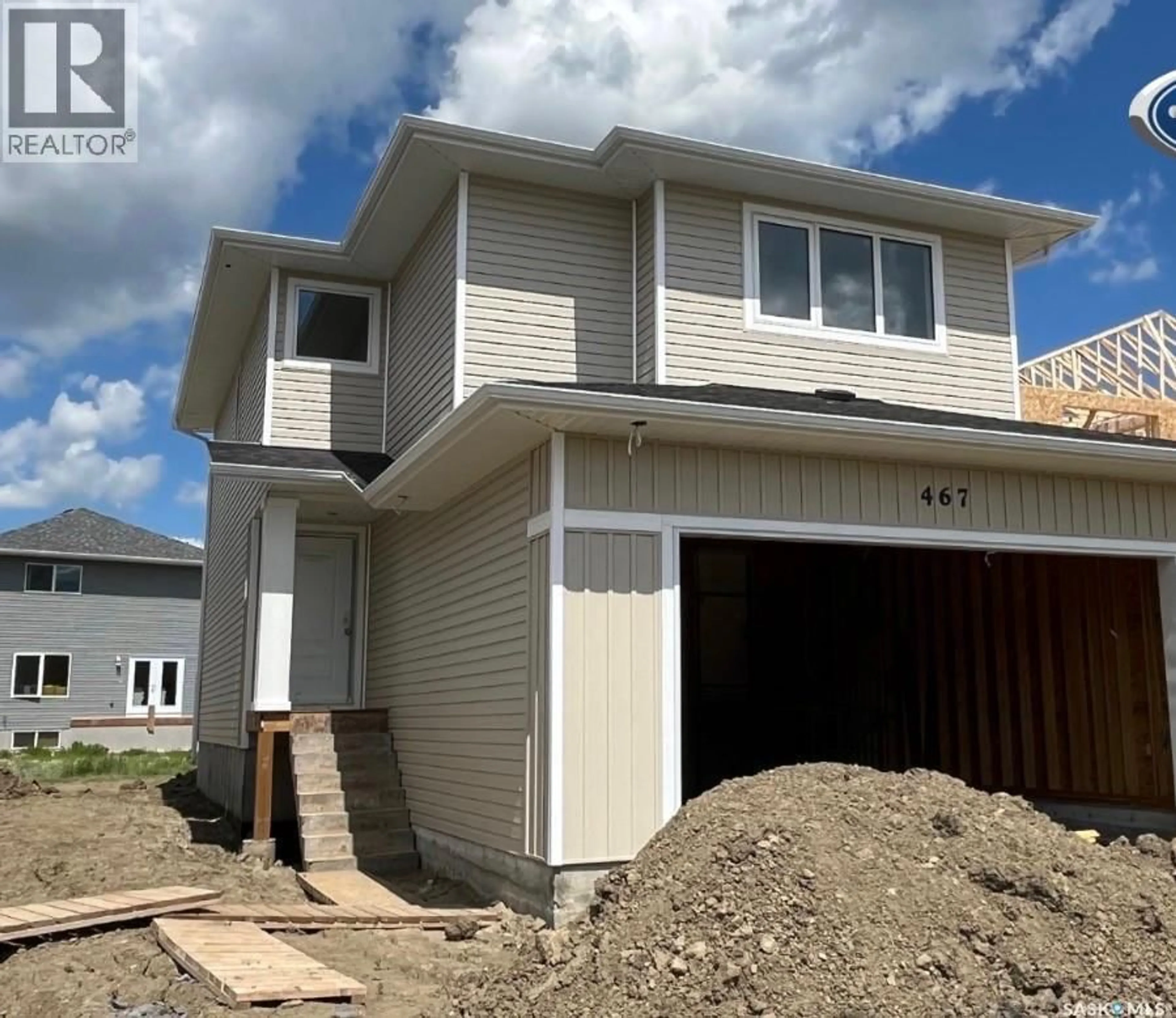 Home with vinyl exterior material, street for 467 TRAEGER CLOSE, Saskatoon Saskatchewan S7V1Z5