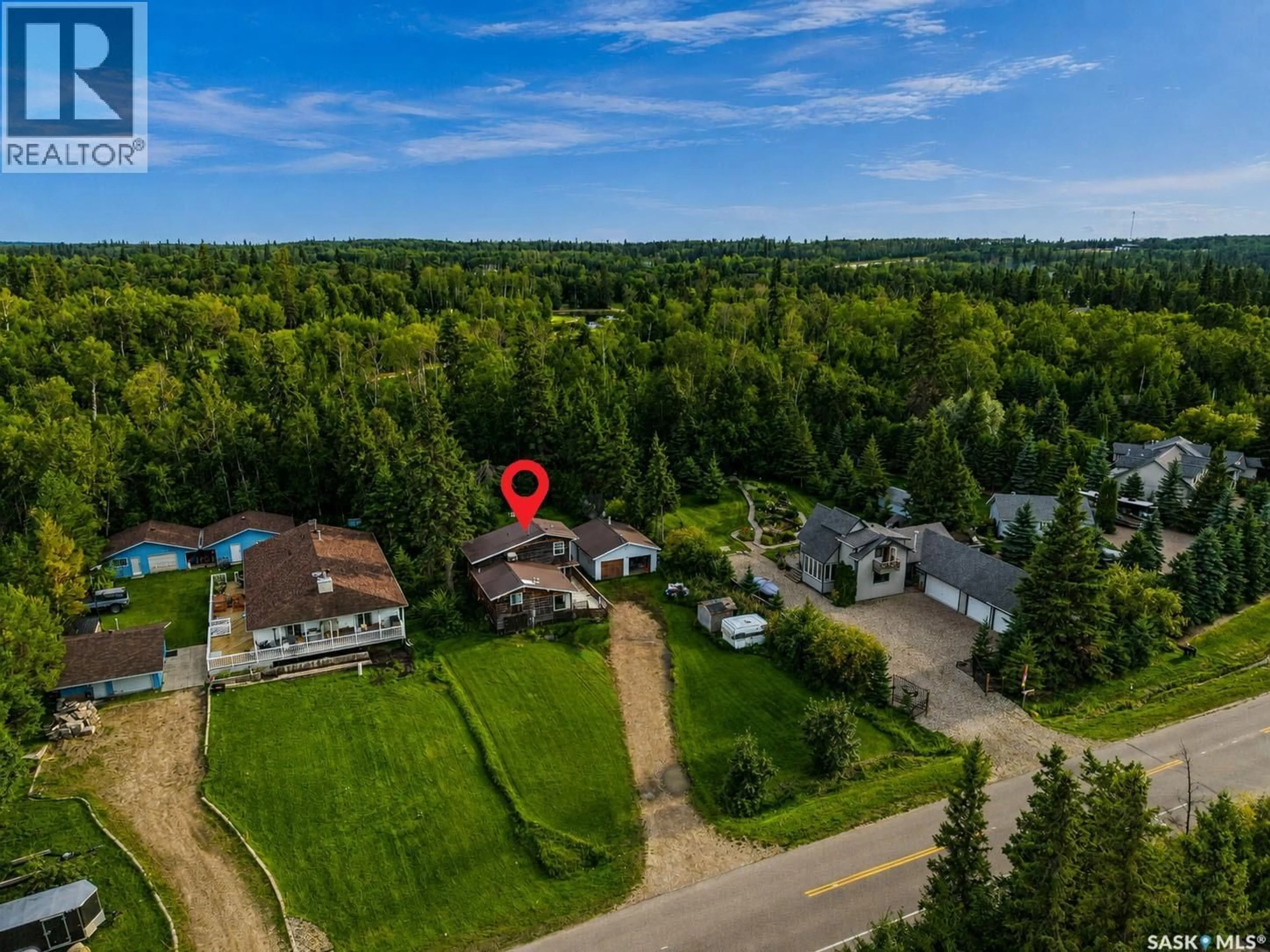 A pic from outside/outdoor area/front of a property/back of a property/a pic from drone, forest/trees view for 279 SOUTHSHORE DRIVE, Emma Lake Saskatchewan S0J0N0