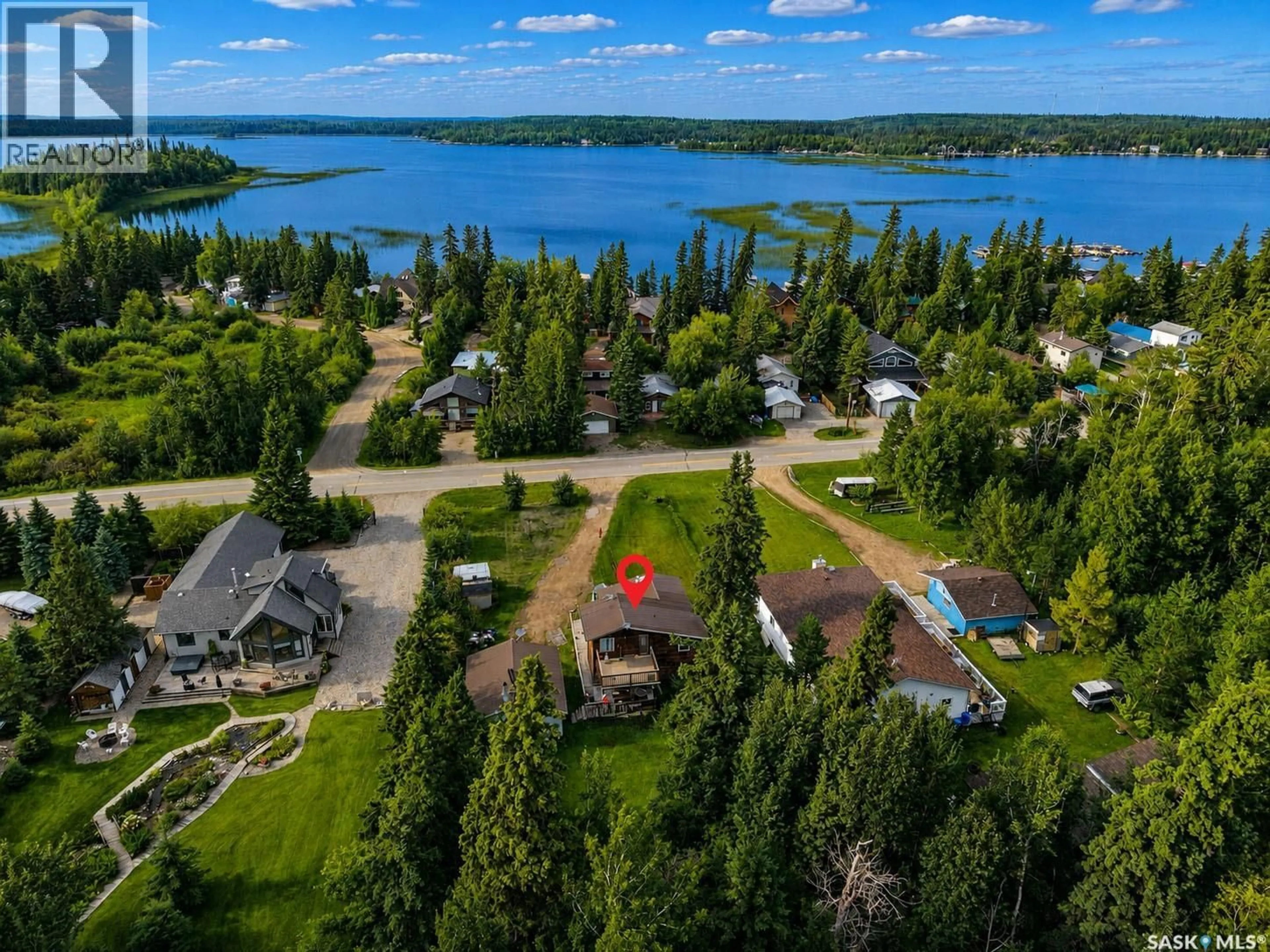 A pic from outside/outdoor area/front of a property/back of a property/a pic from drone, water/lake/river/ocean view for 279 SOUTHSHORE DRIVE, Emma Lake Saskatchewan S0J0N0