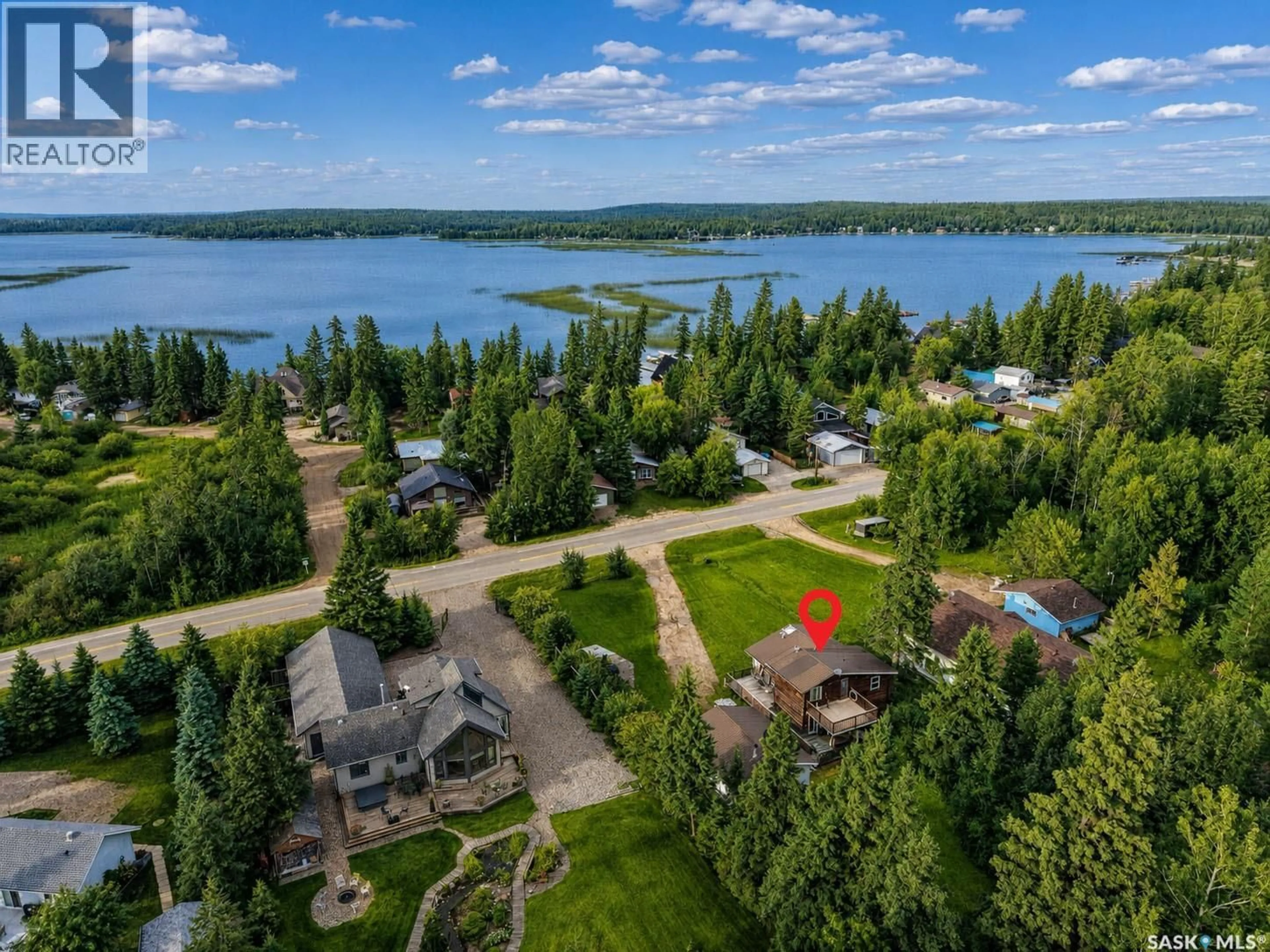 A pic from outside/outdoor area/front of a property/back of a property/a pic from drone, water/lake/river/ocean view for 279 SOUTHSHORE DRIVE, Emma Lake Saskatchewan S0J0N0